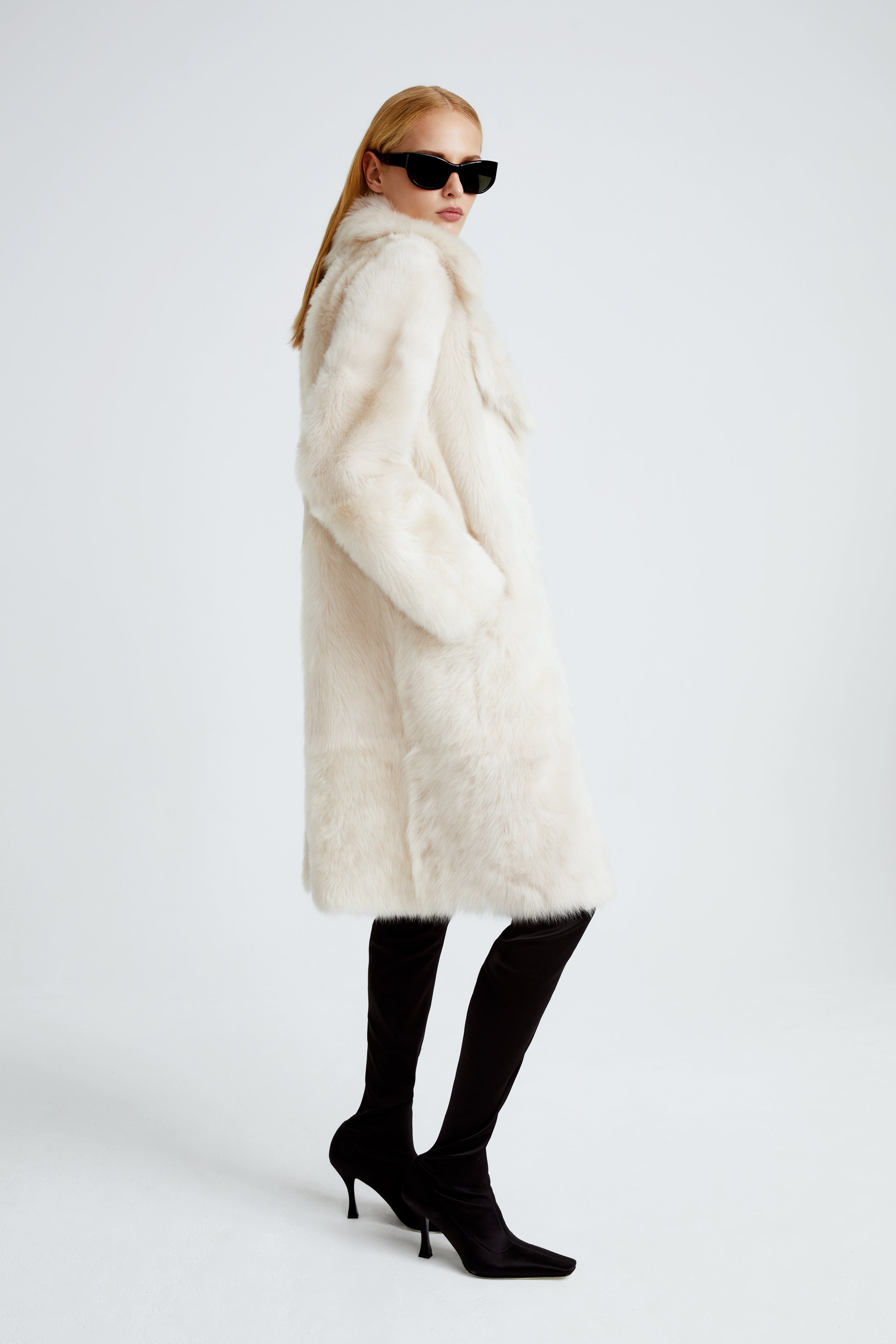 Model is wearing the Evita Cloud Après-Ski Shearling Coat Side