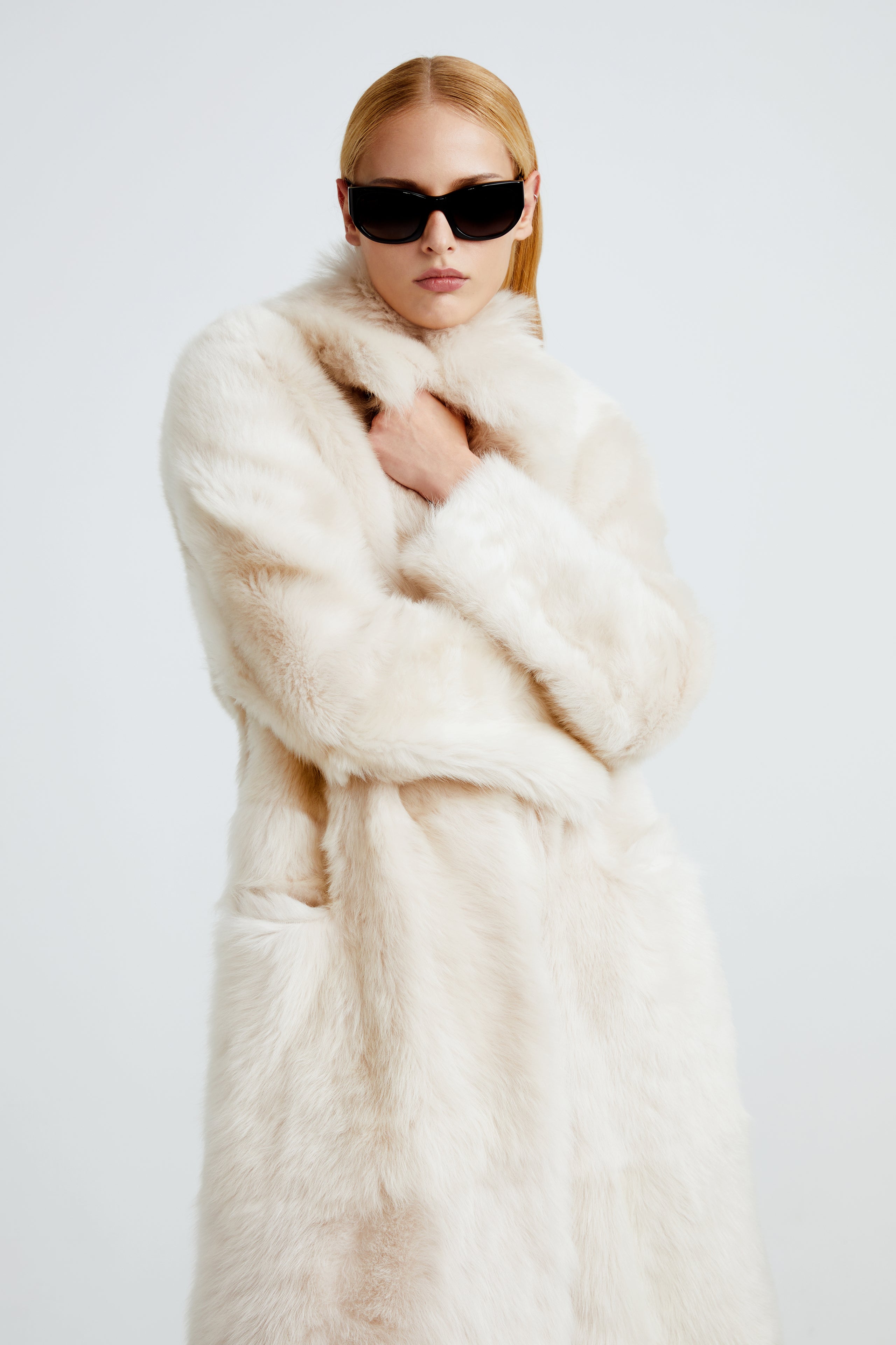 Model is wearing the Evita Cloud Après-Ski Shearling Coat Close Up