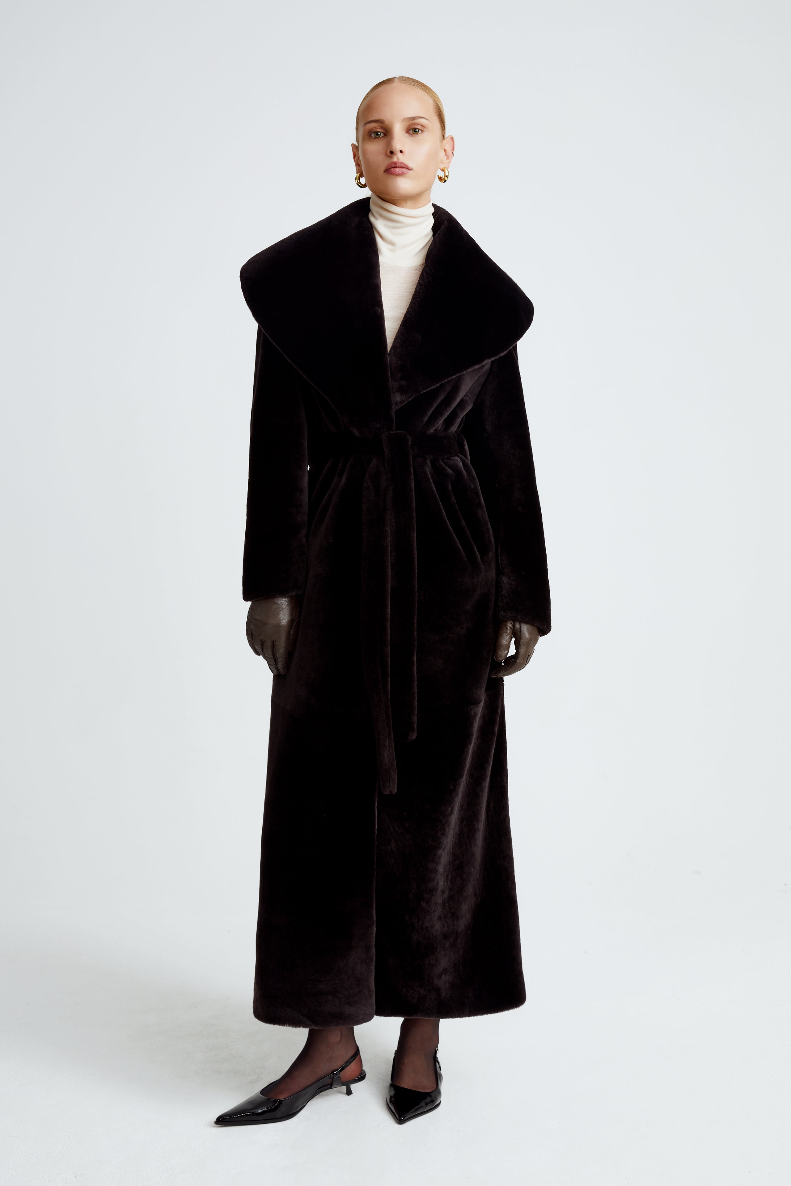 Model is wearing the Giovanna Chocolat Fondant Long Shearling Coat Front