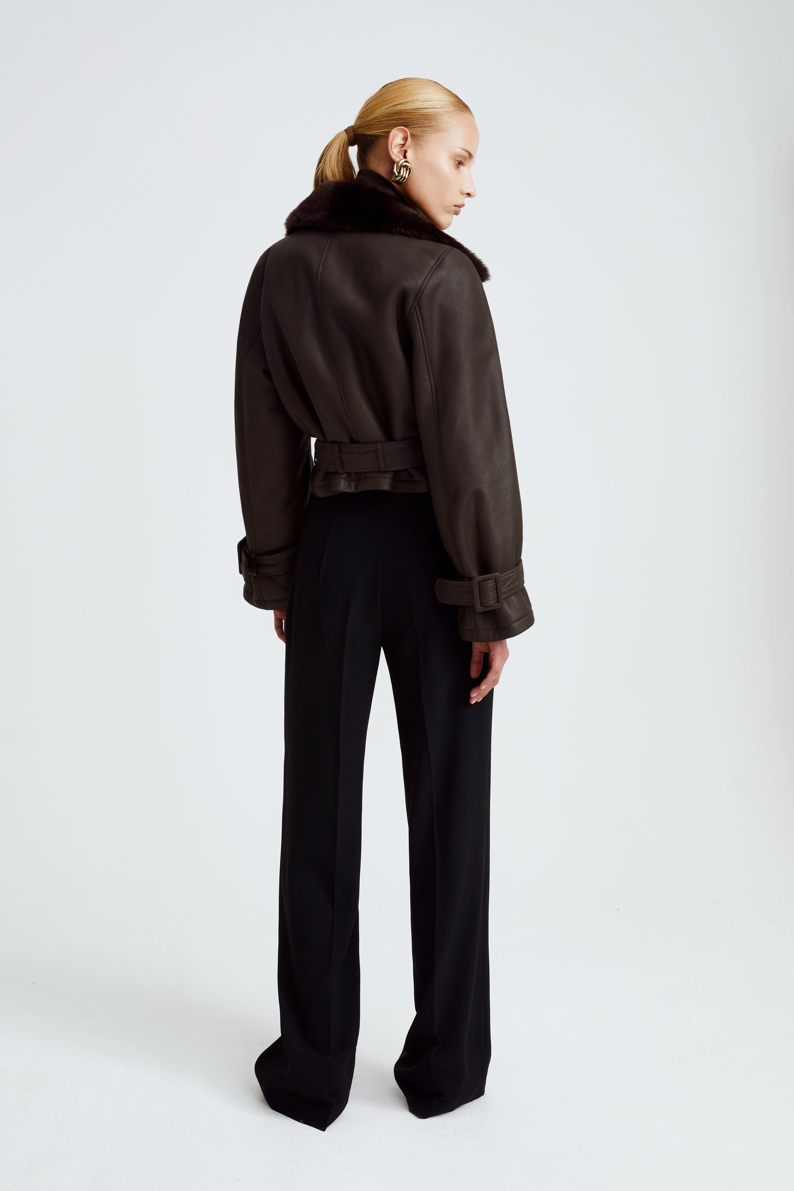 Model is wearing the Hatti Shearling Chocolat Fondant Cropped Shearling Jacket Back