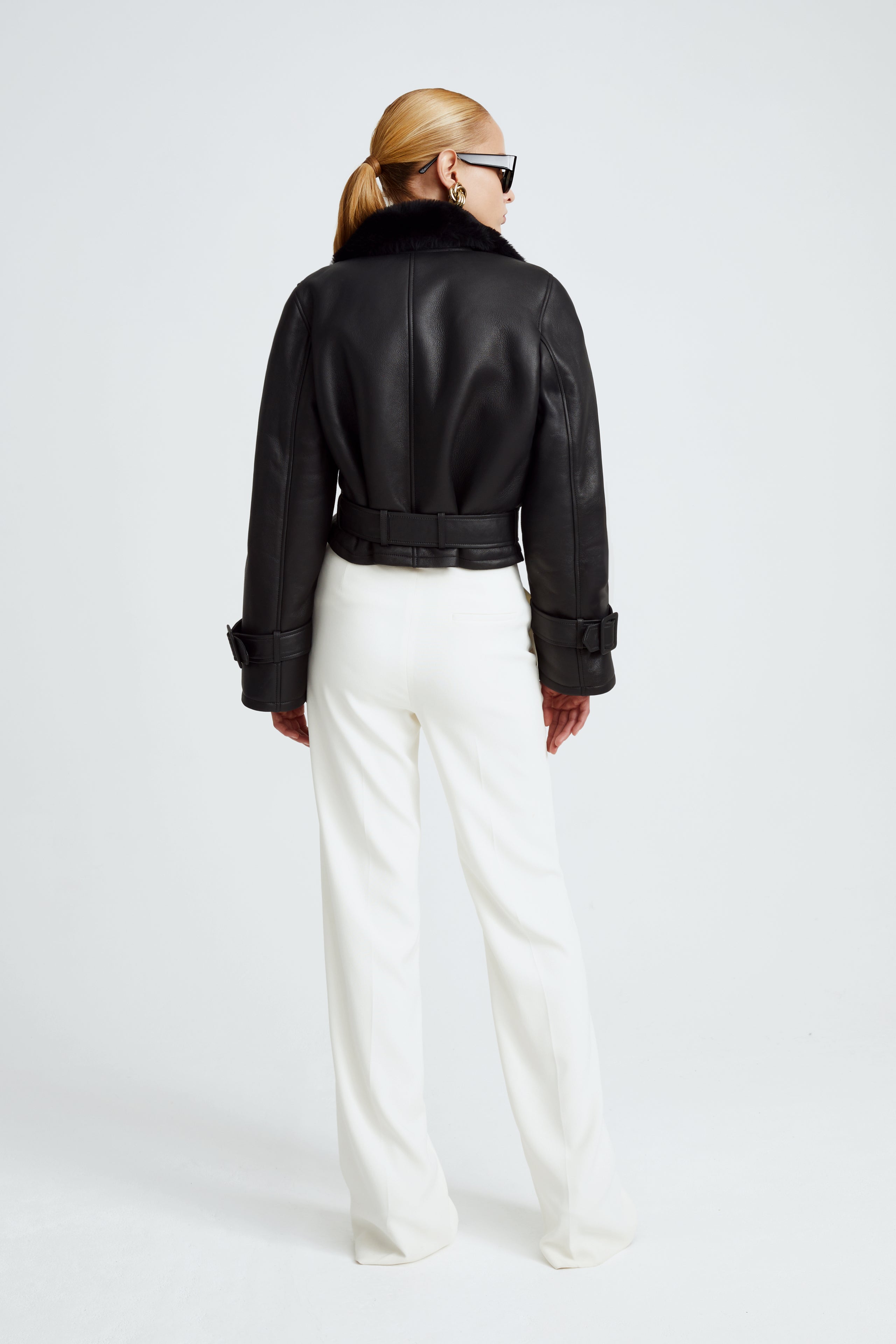 Model is wearing the Hatti Shearling Black Cropped Shearling Jacket Back