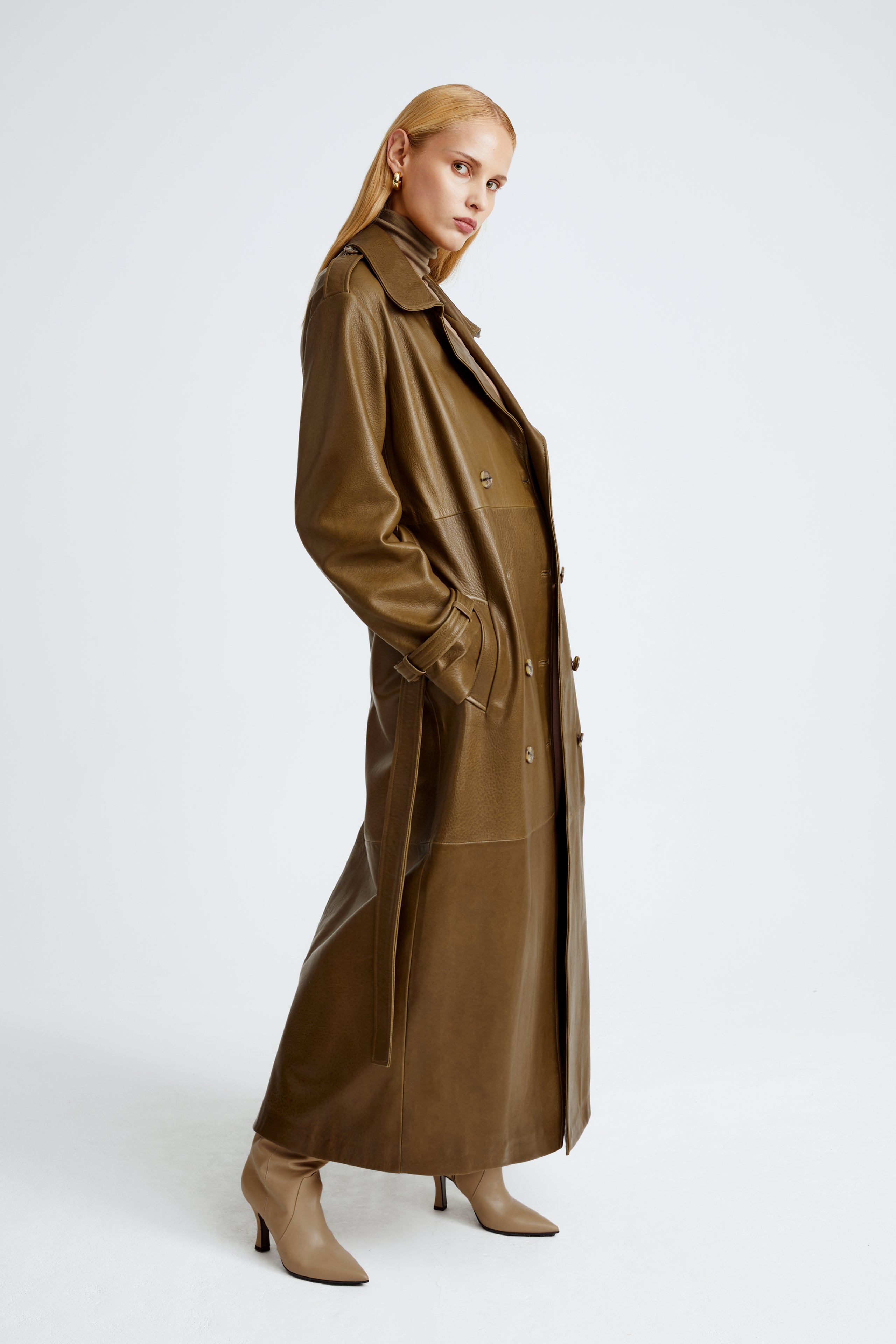 Model is wearing the Haya Zeytoun Belted Leather Trench Coat Side