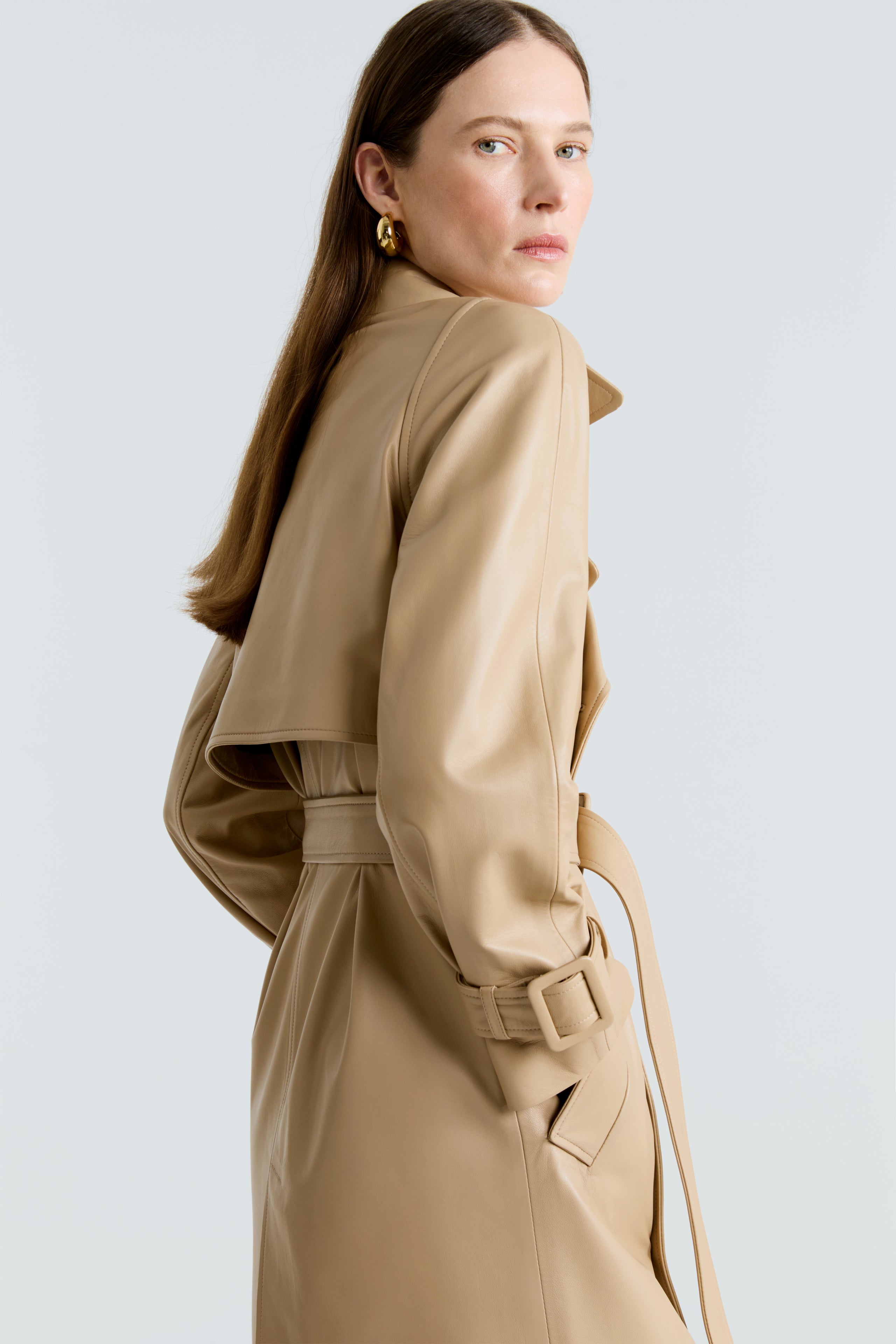 Model is wearing the Henri Beige Leather Trench Coat Close Up
