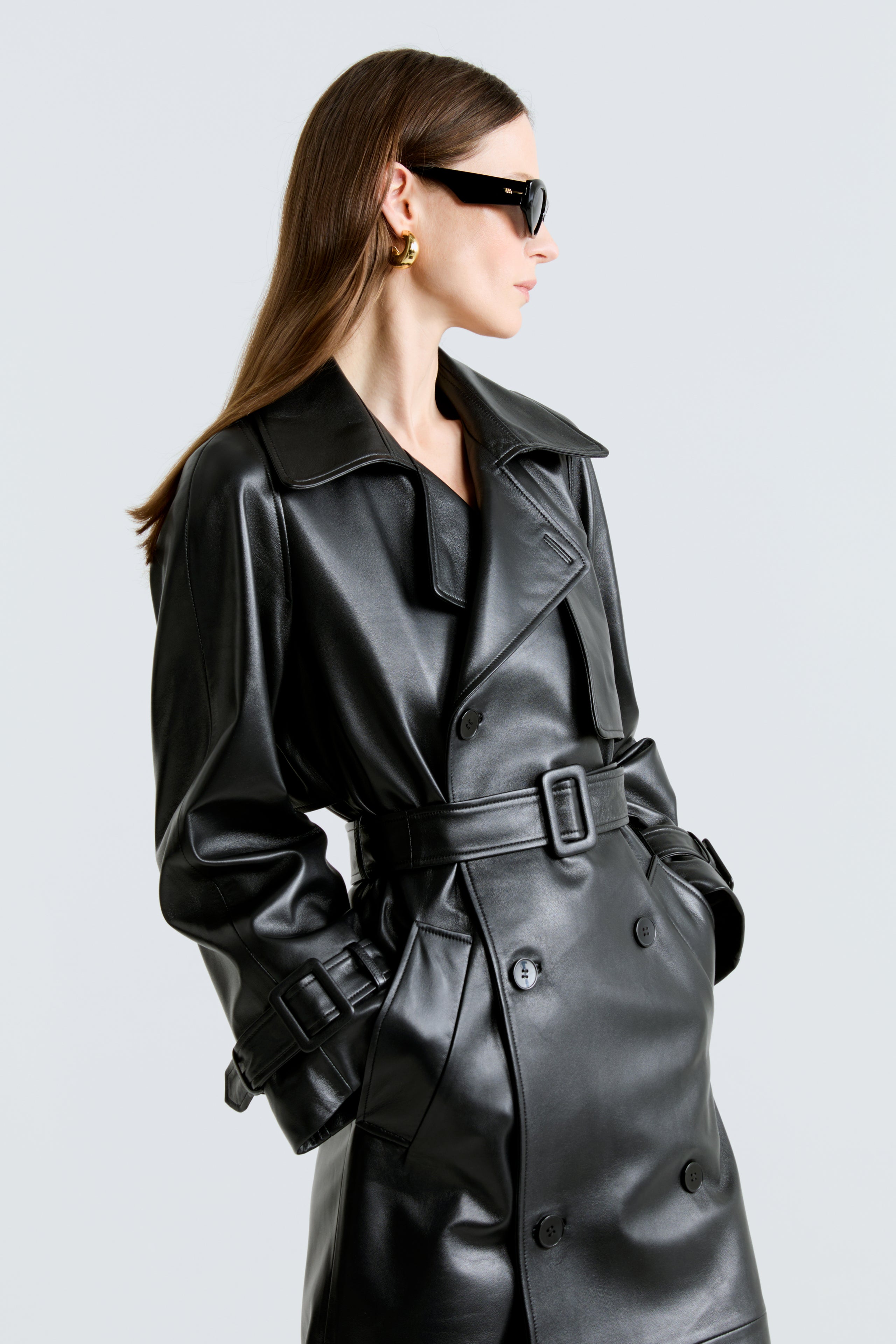 Model is wearing the Henri Black Leather Trench Coat Close Up