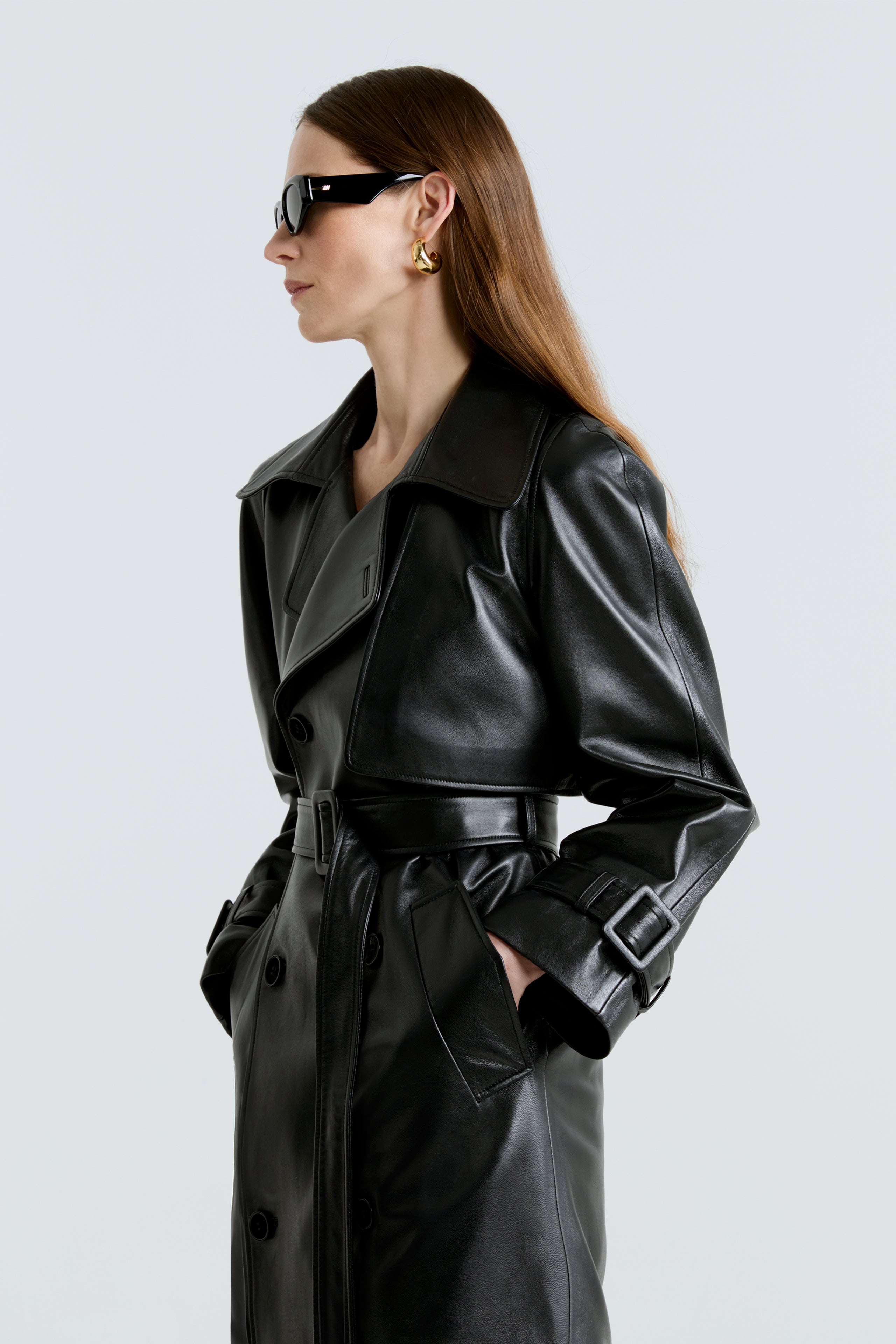 Model is wearing the Henri Black Leather Trench Coat Close Up
