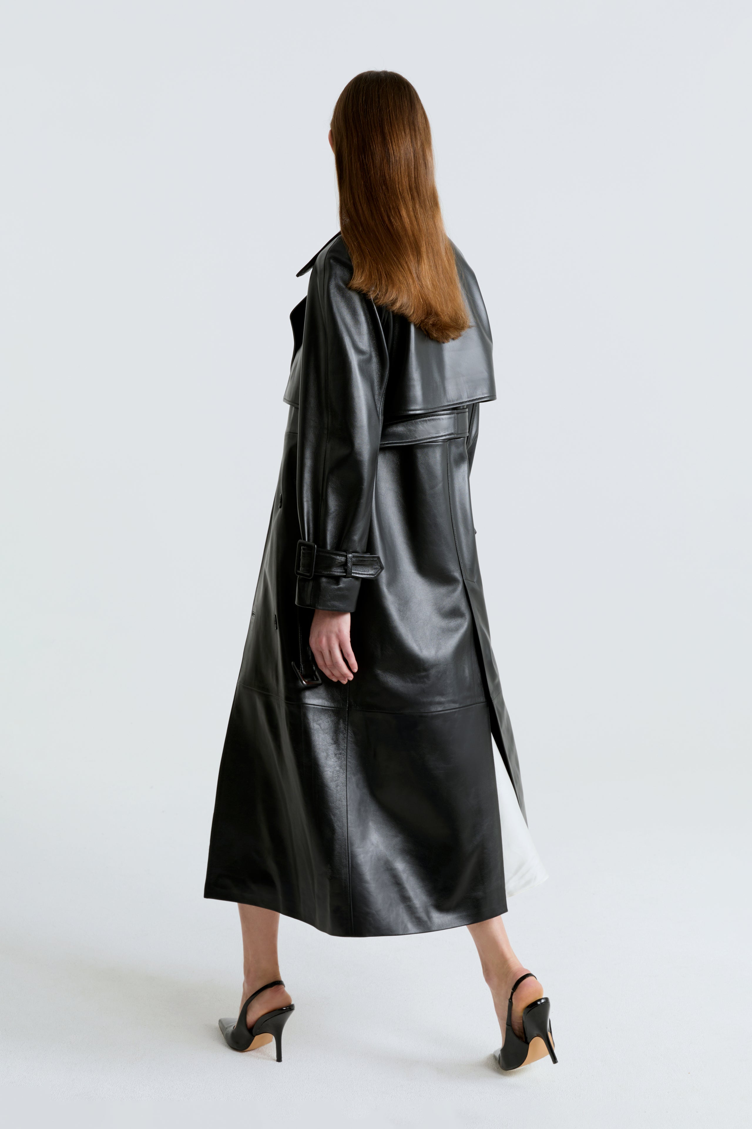 Model is wearing the Henri Black Leather Trench Coat Back
