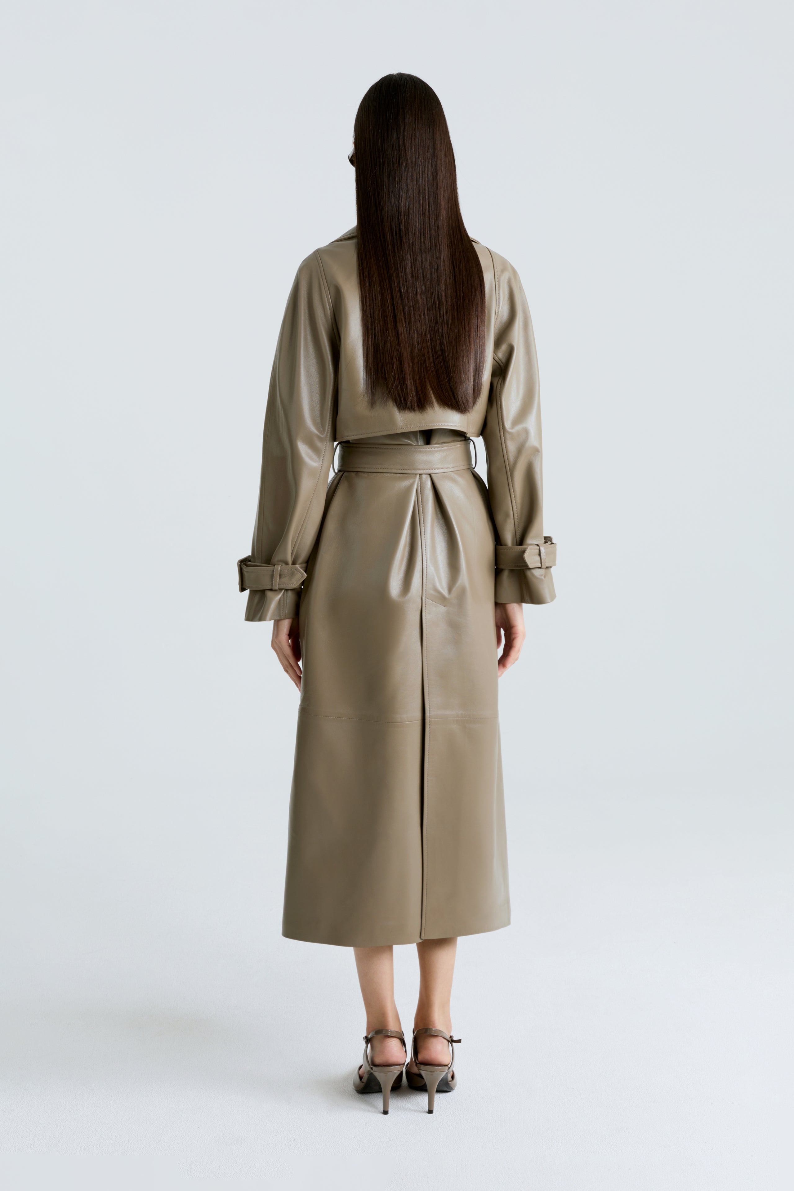 Model is wearing the Henri Cepe Leather Trench Coat Back