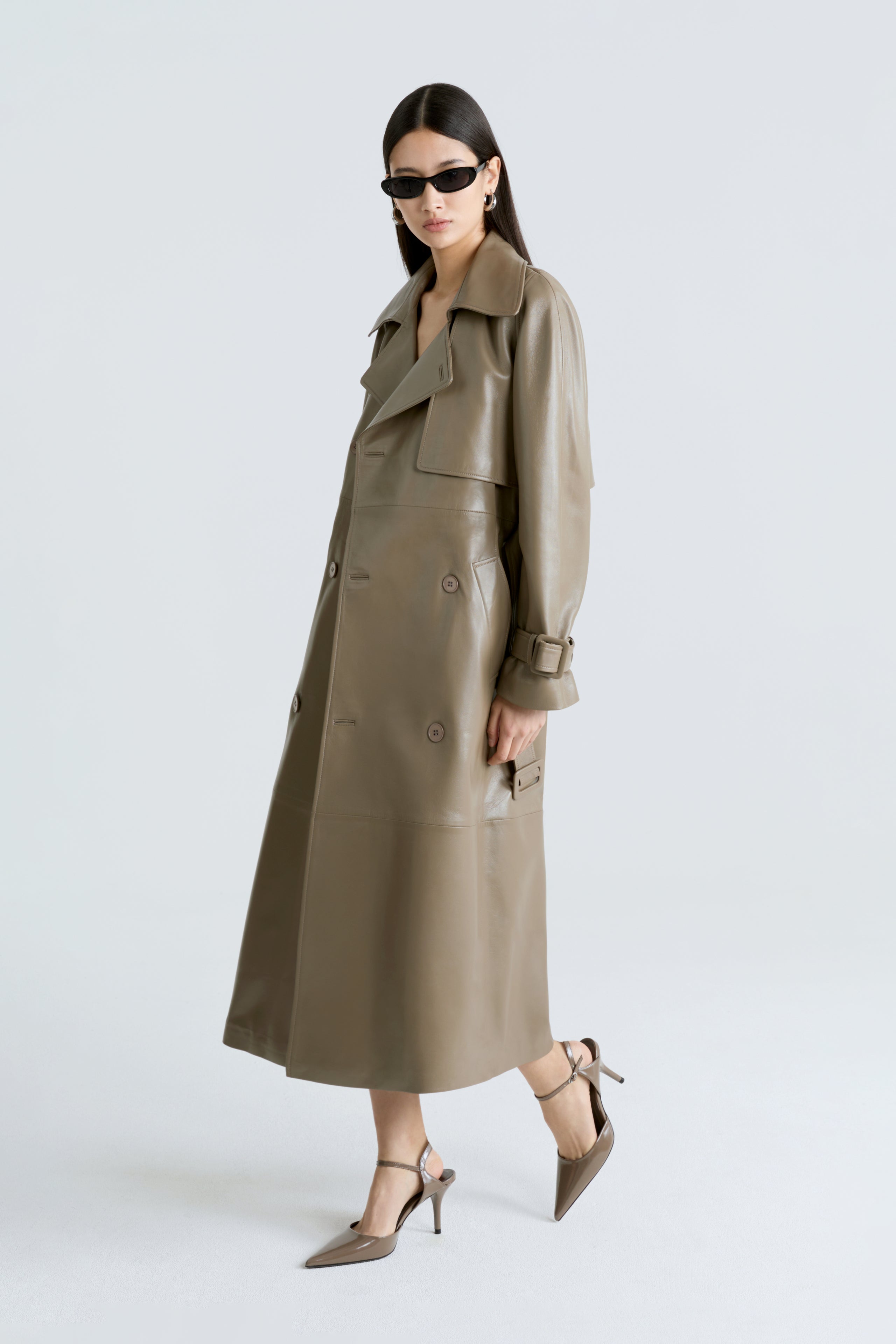 Model is wearing the Henri Cepe Leather Trench Coat Side