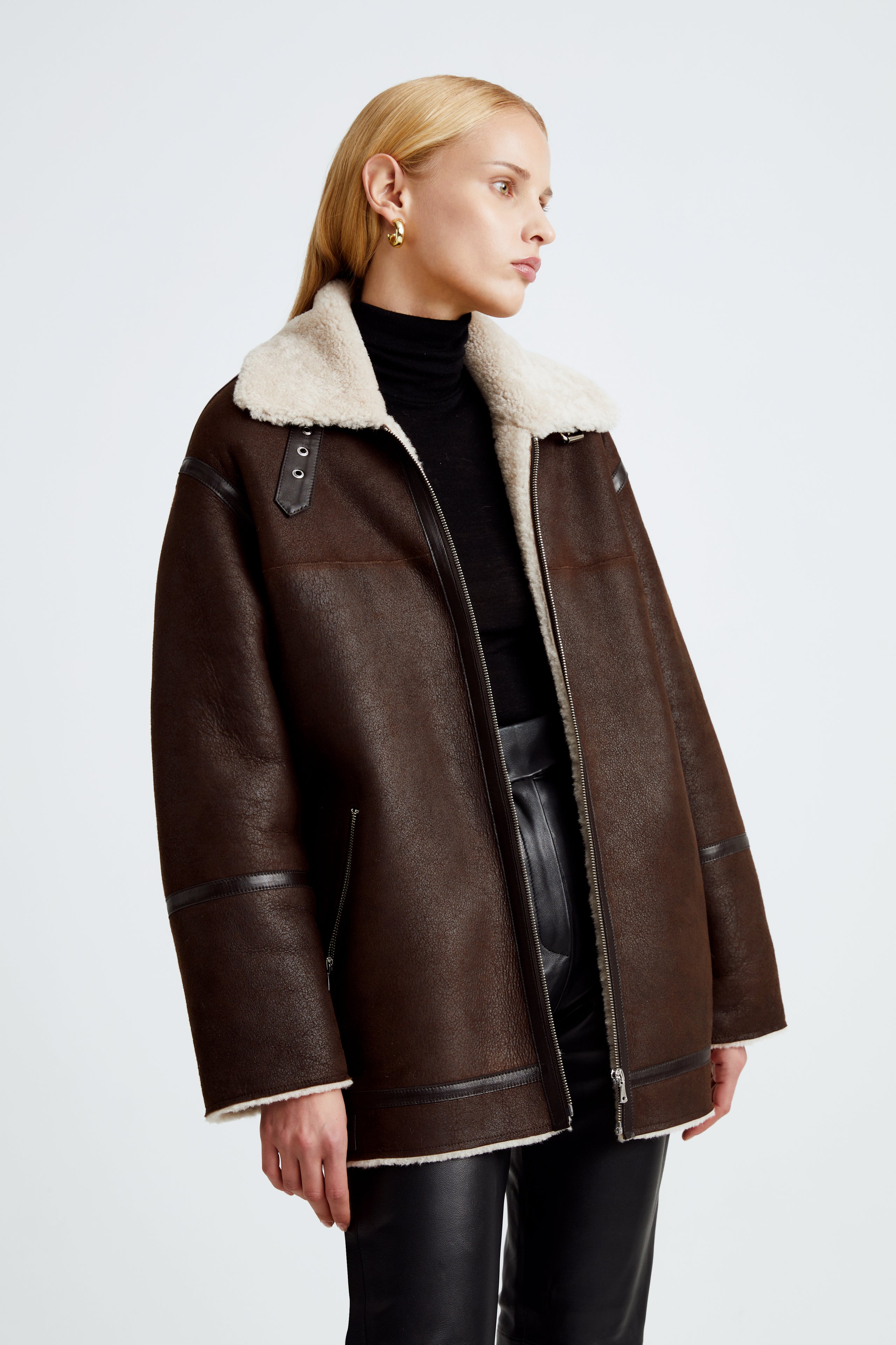 Model is wearing the Horizon Chocolat Fondant Cream Shearling Aviator Coat Close Up