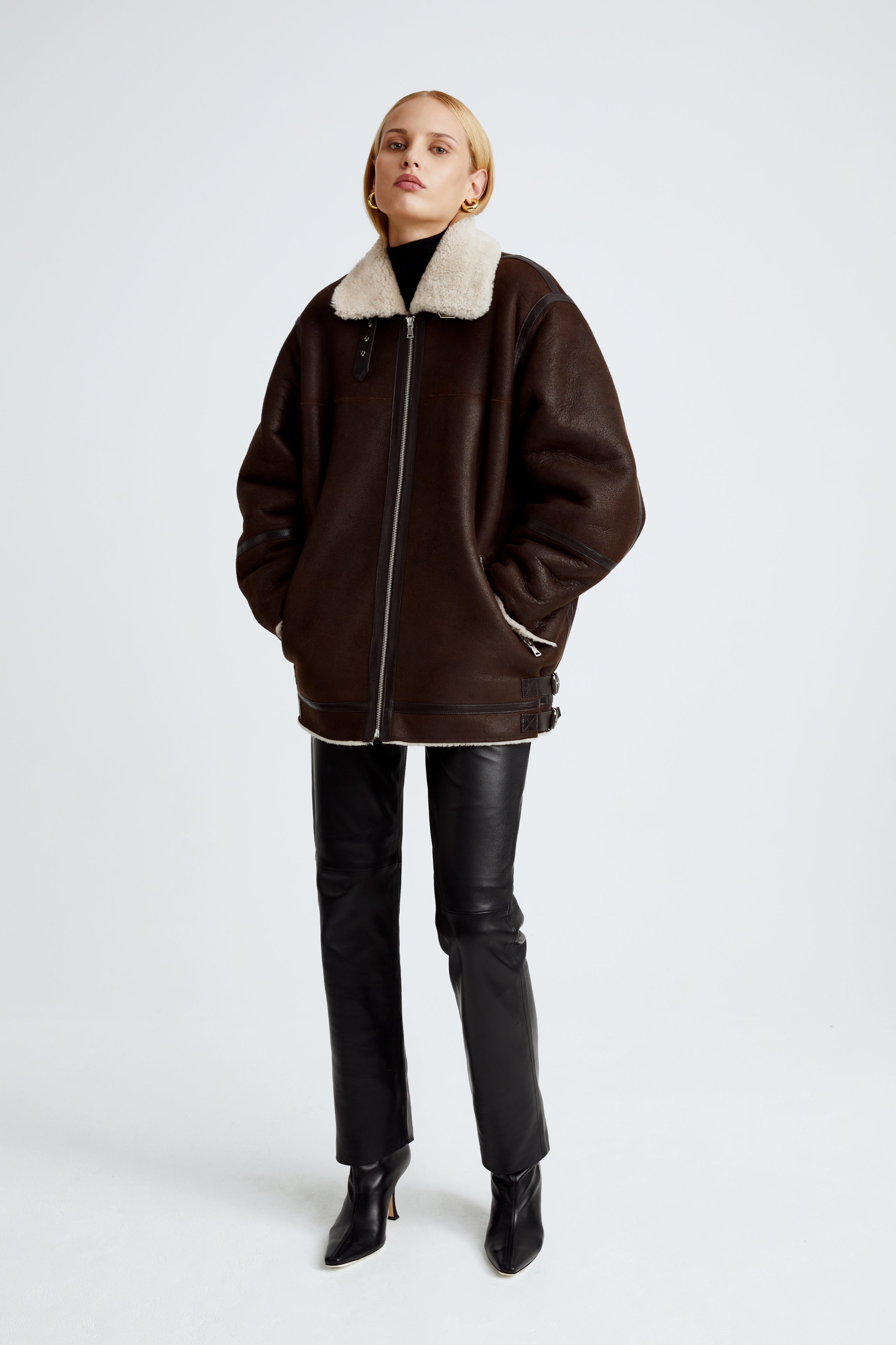Model is wearing the Horizon Chocolat Fondant Cream Shearling Aviator Coat Front