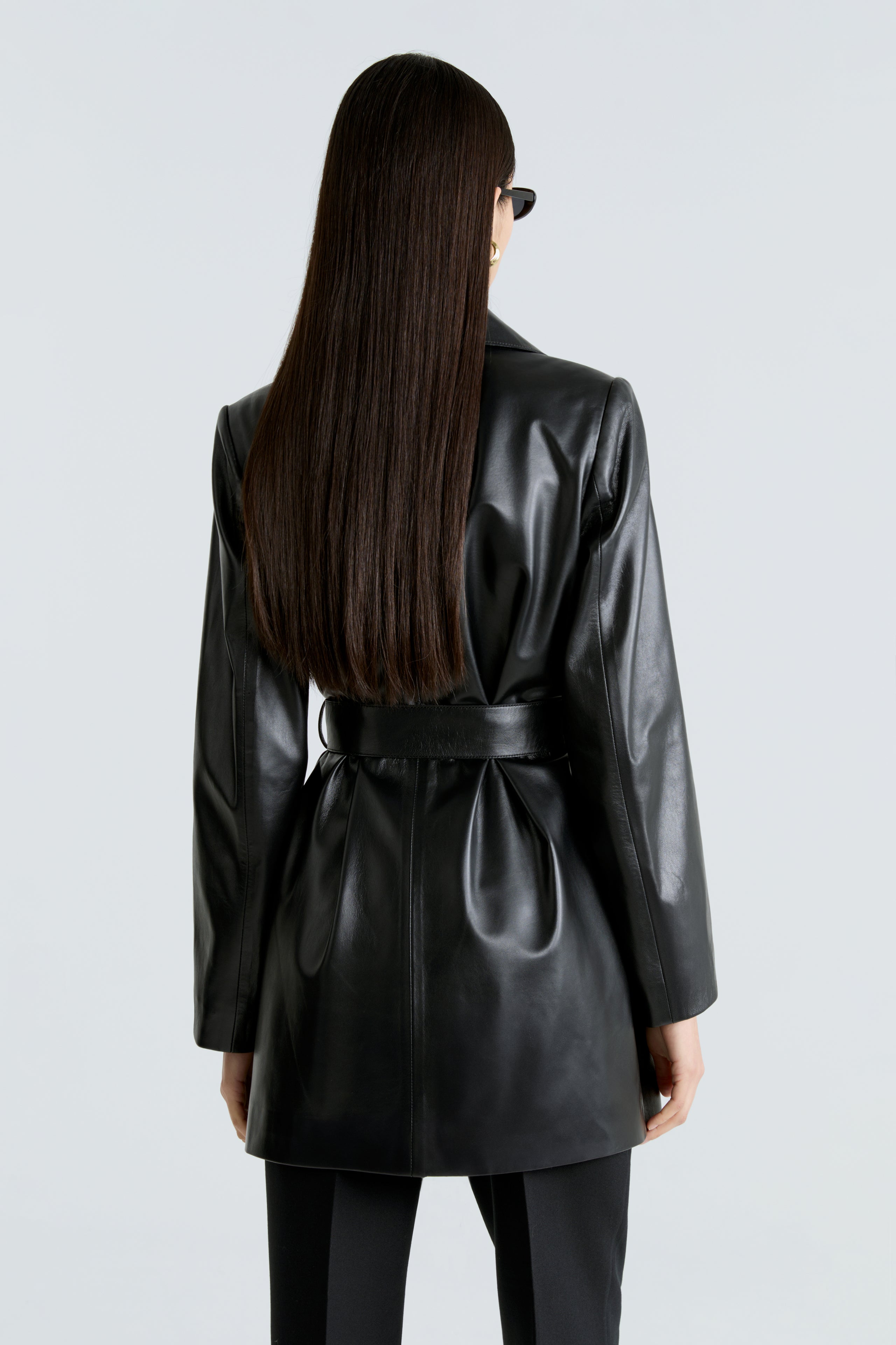 Model is wearing the Kerri Black Belted Ladylike Jacket Back