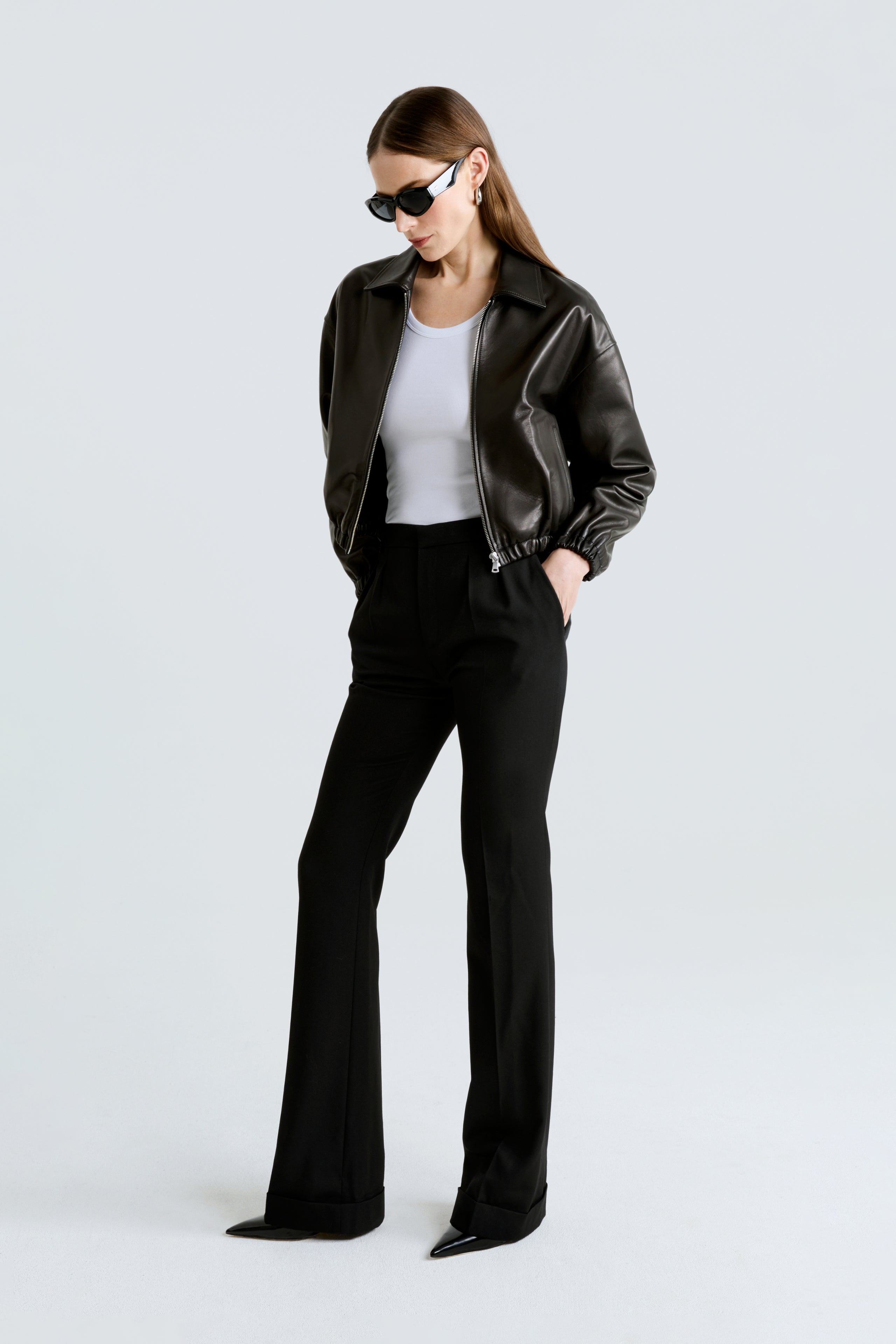 Model is wearing the Nour Hammour Luna Black Bomber Leather Jacket Side