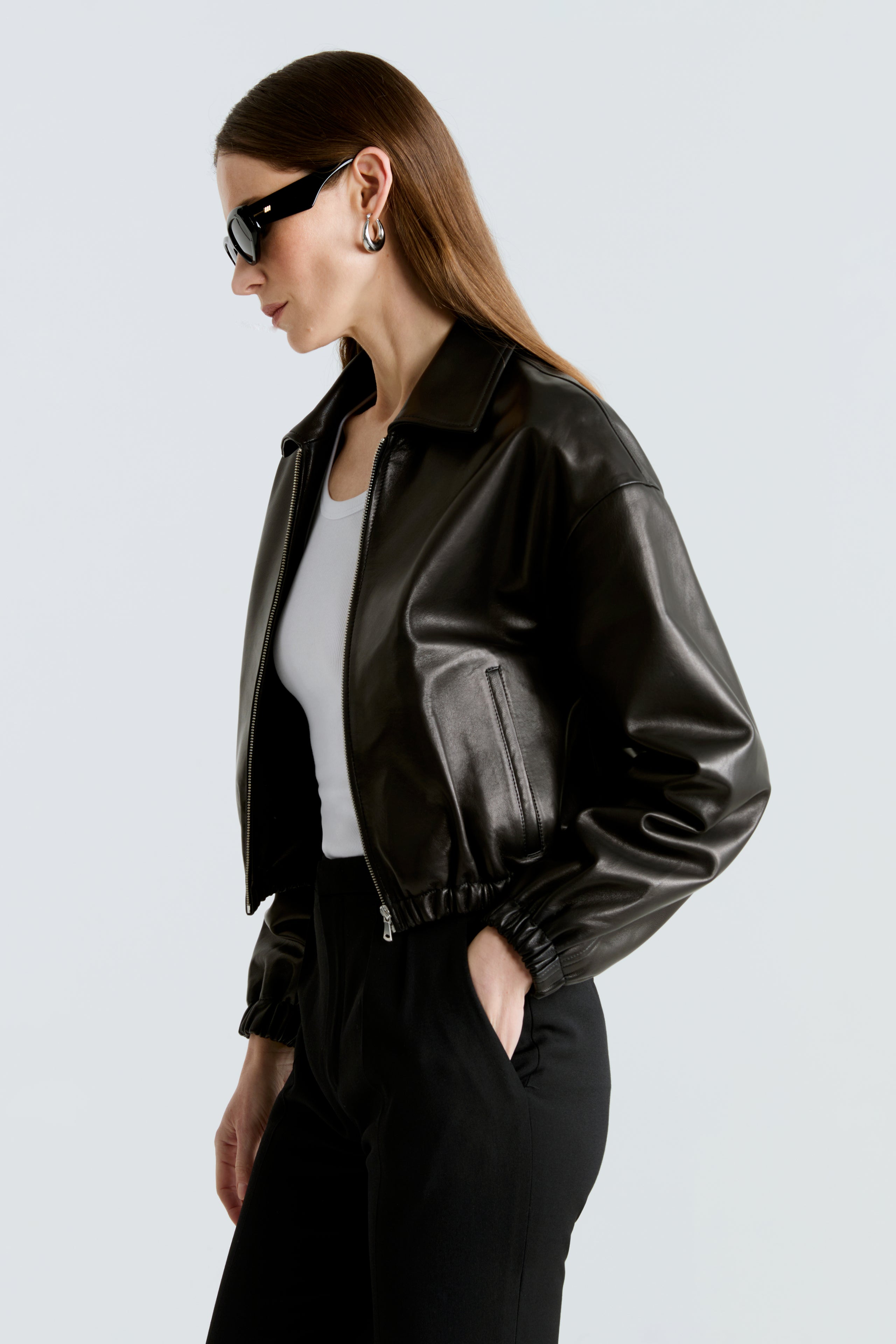 Model is wearing the Nour Hammour Luna Black Bomber Leather Jacket Close Up