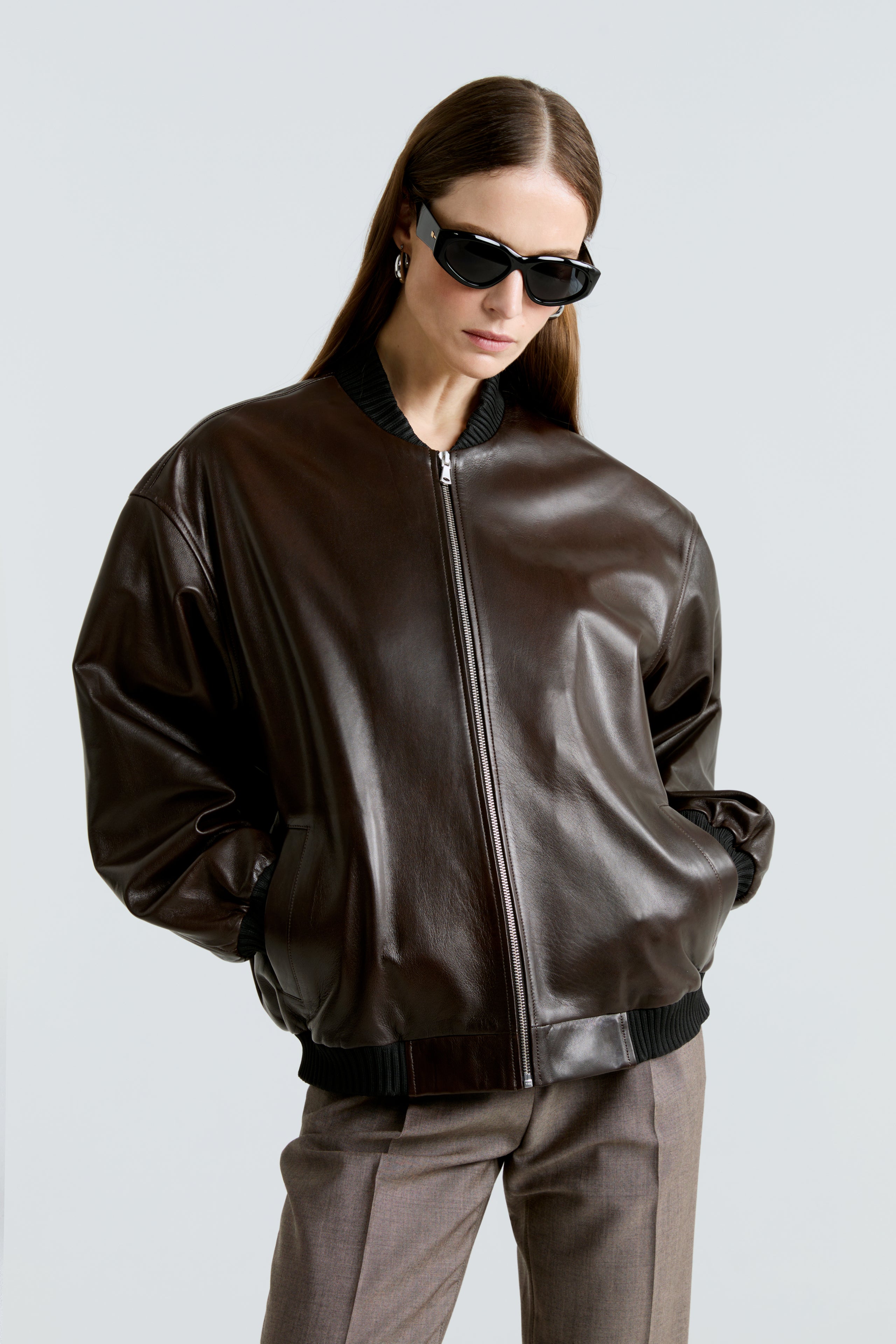 Model is wearing Nour Hammour's Marly 40s Bomber Jacket in syrup - Close Up 