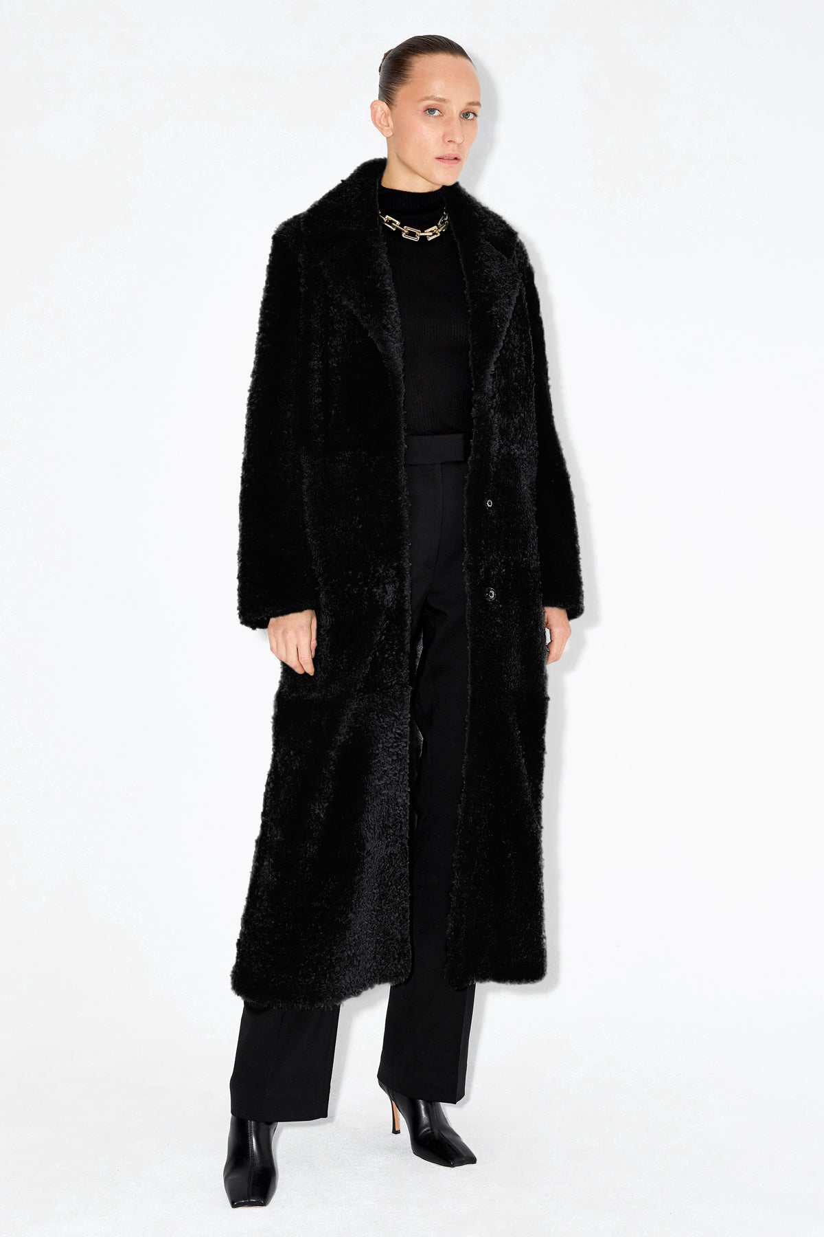 Model is wearing the Louize Black Elegant Shearling Coat Front