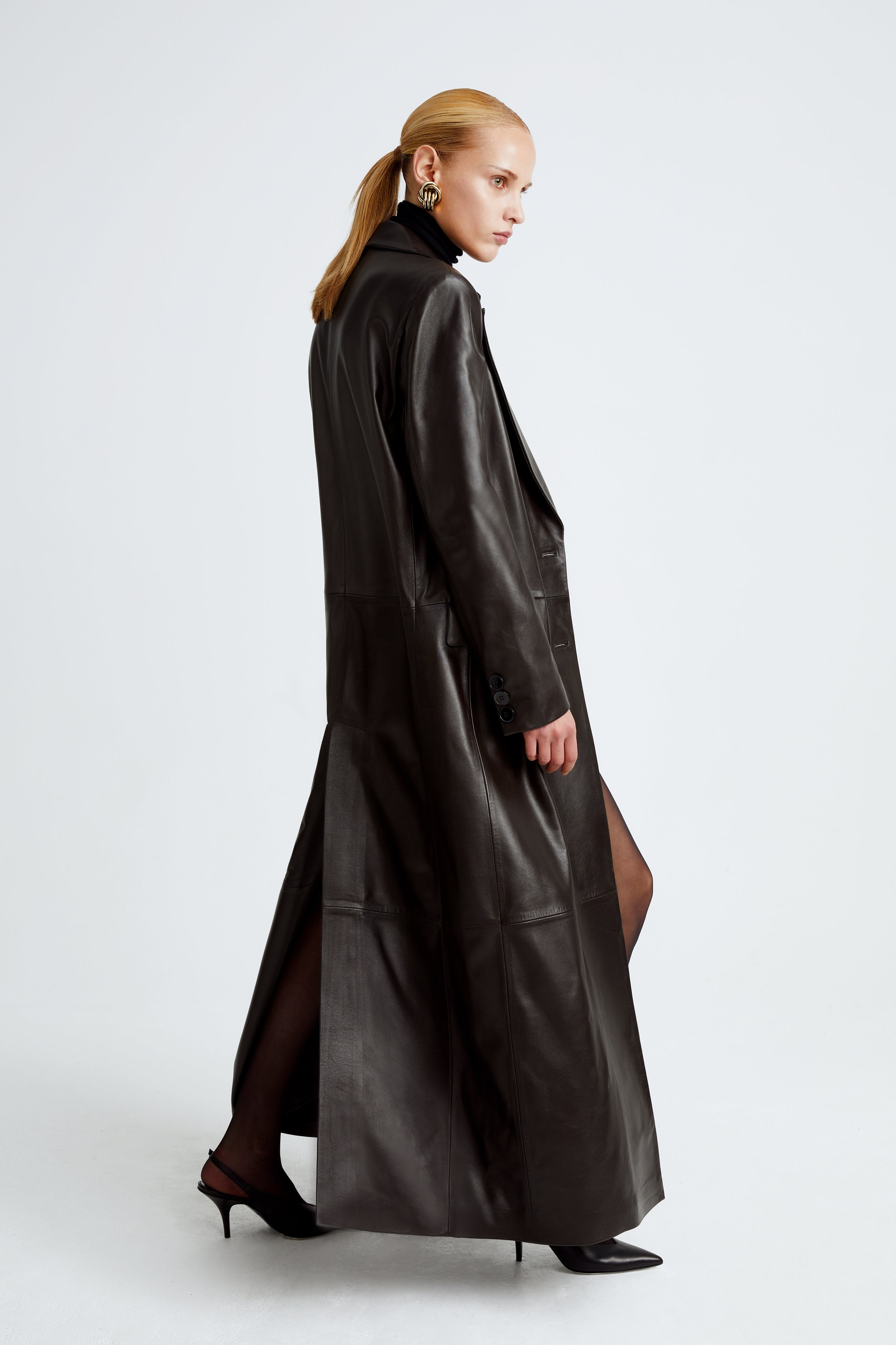 Model is wearing the Misha Chocolat Fondant Long Leather Coat Side