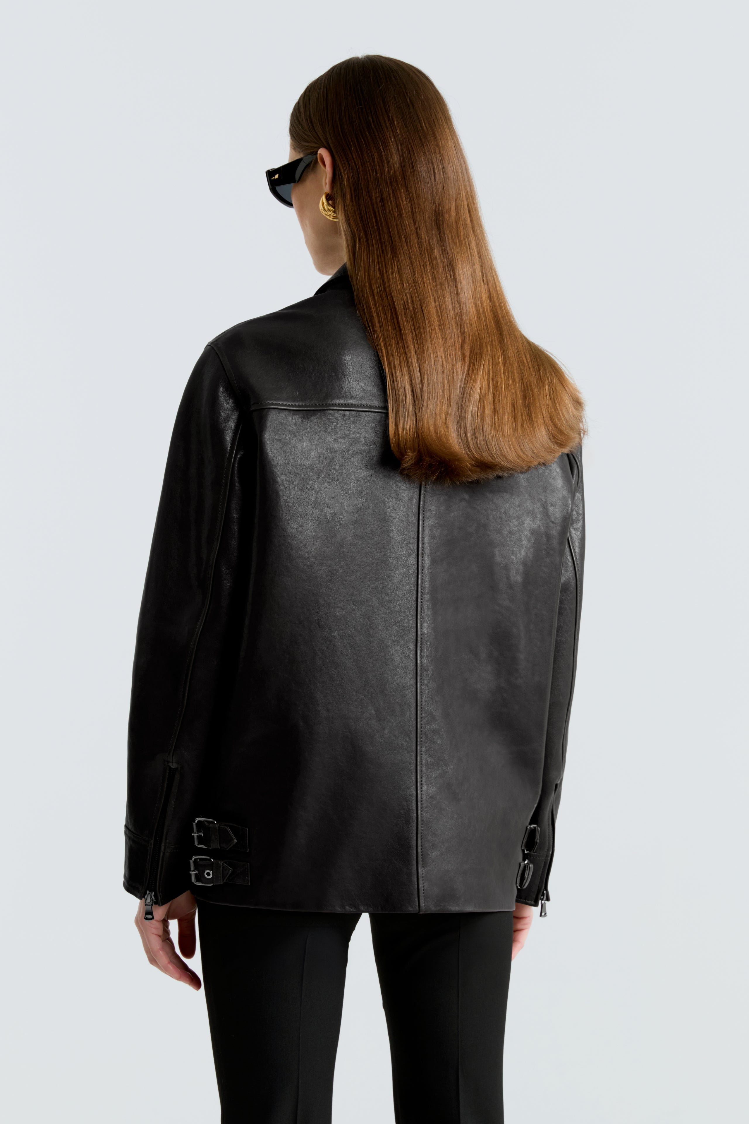 Model is wearing the Rayan Black Utilitarian Leather Jacket Back