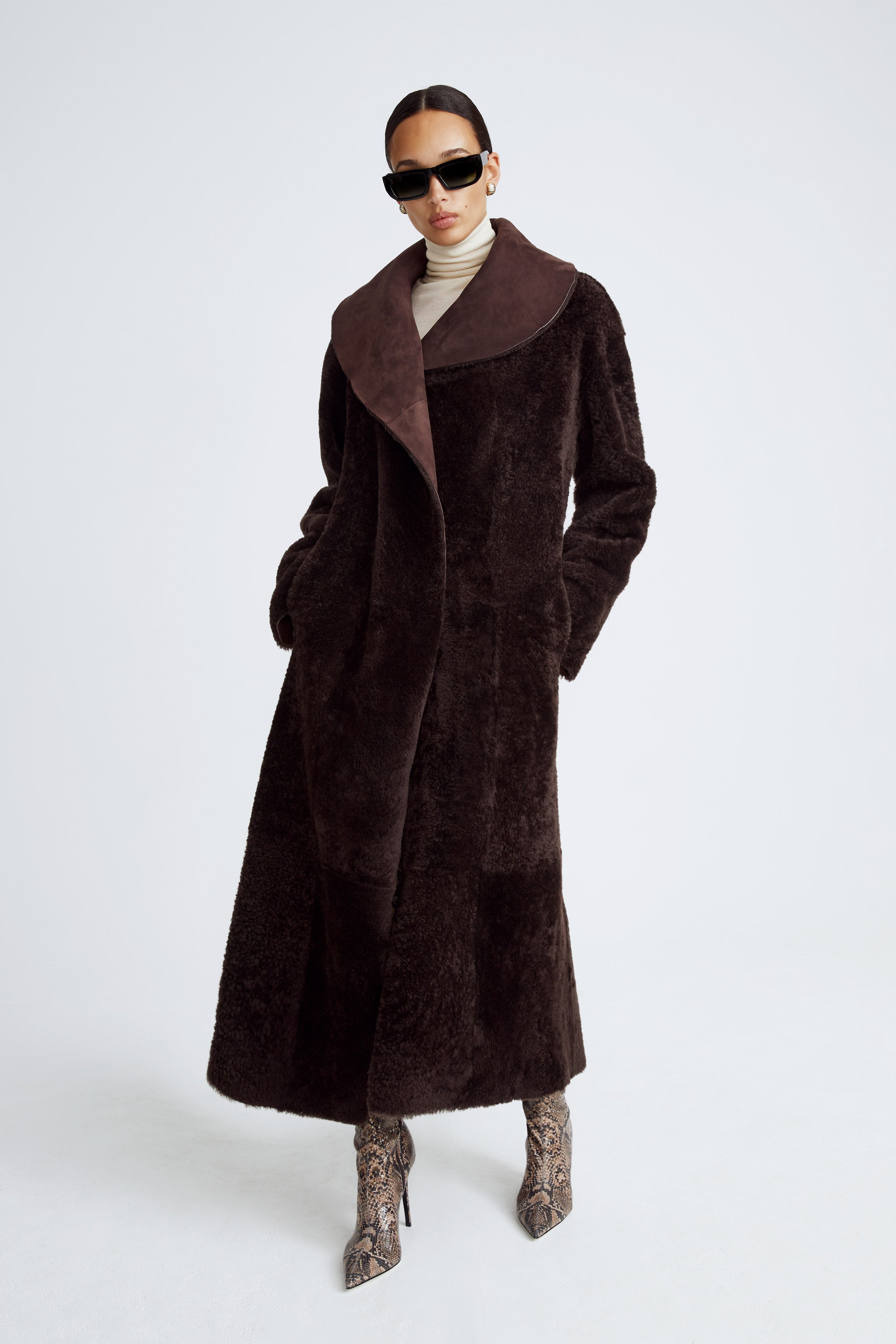 Model is wearing the Agnes Dark Chocolate Reversible Shearling Coat Front