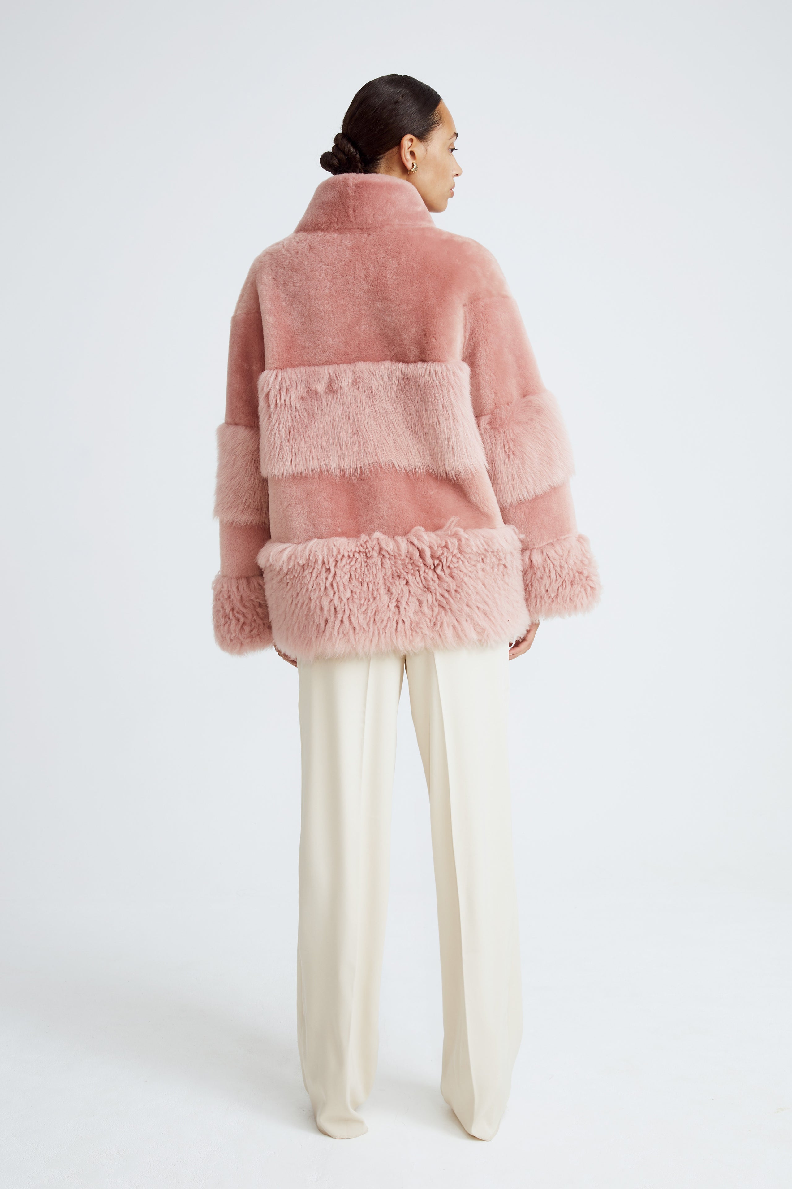 Model is wearing the Aimee Quartz Fluffy Shearling Coat Back