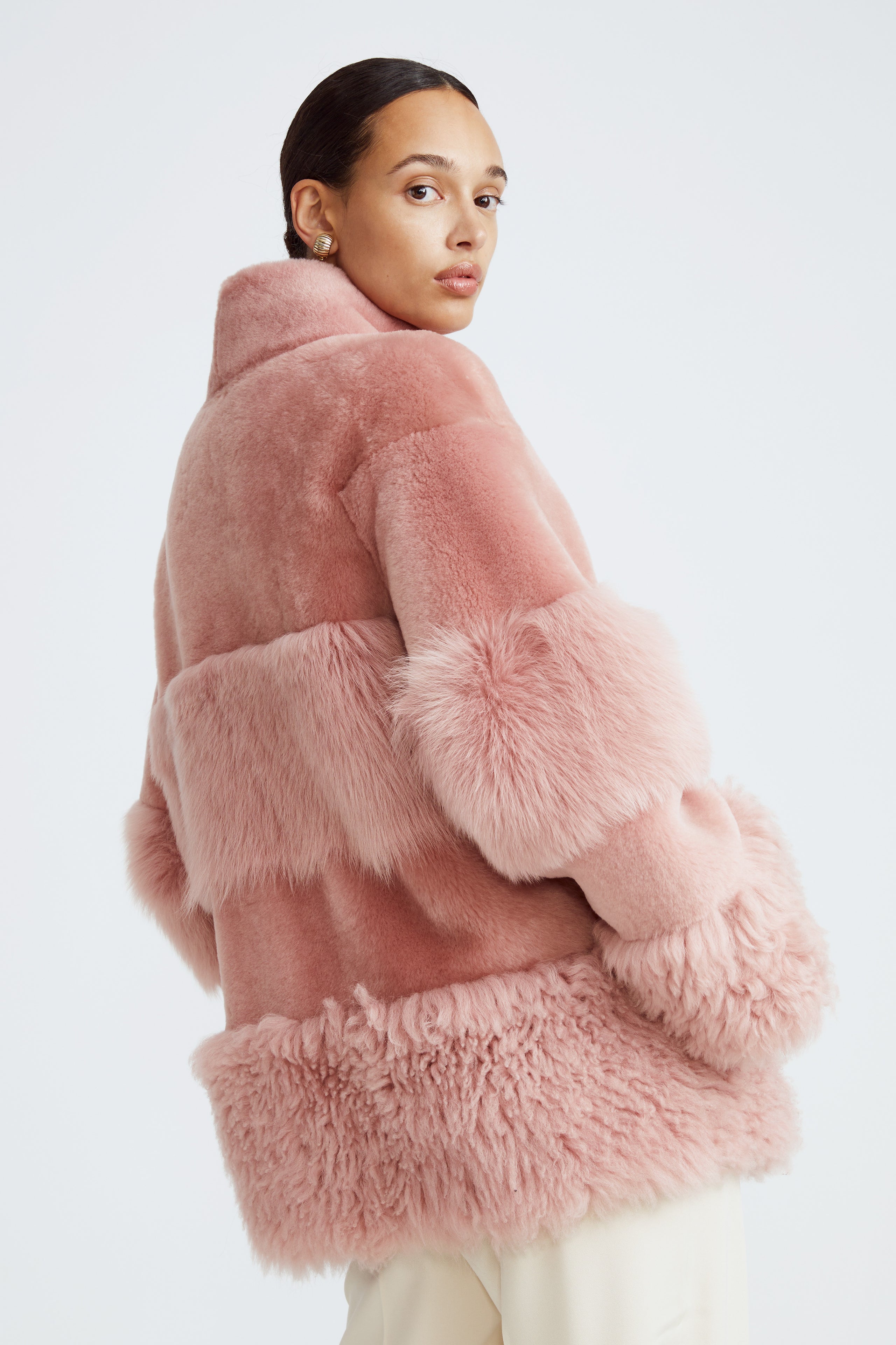 Model is wearing the Aimee Quartz Fluffy Shearling Coat Close Up