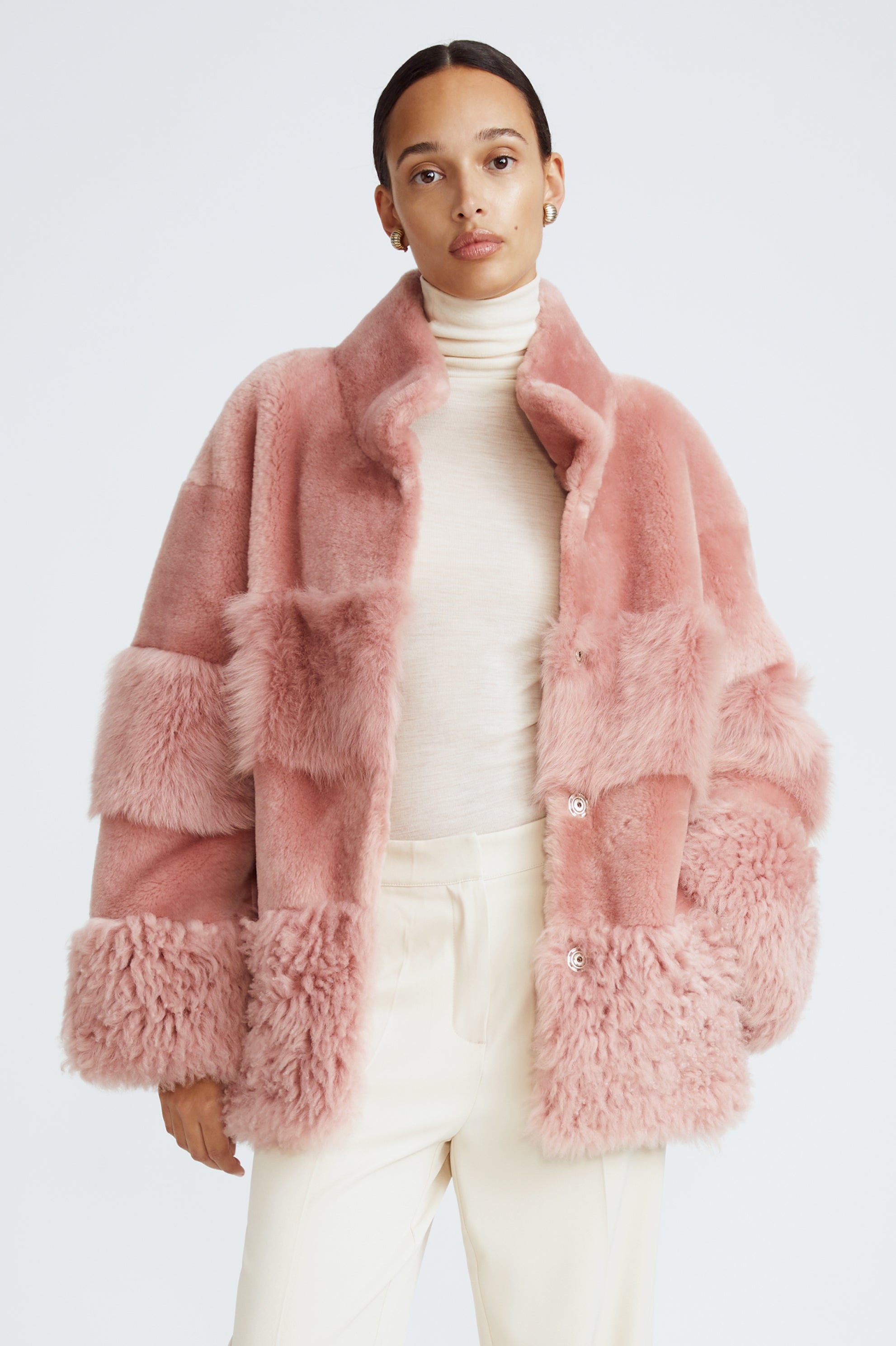 Model is wearing the Aimee Quartz Fluffy Shearling Coat Close Up