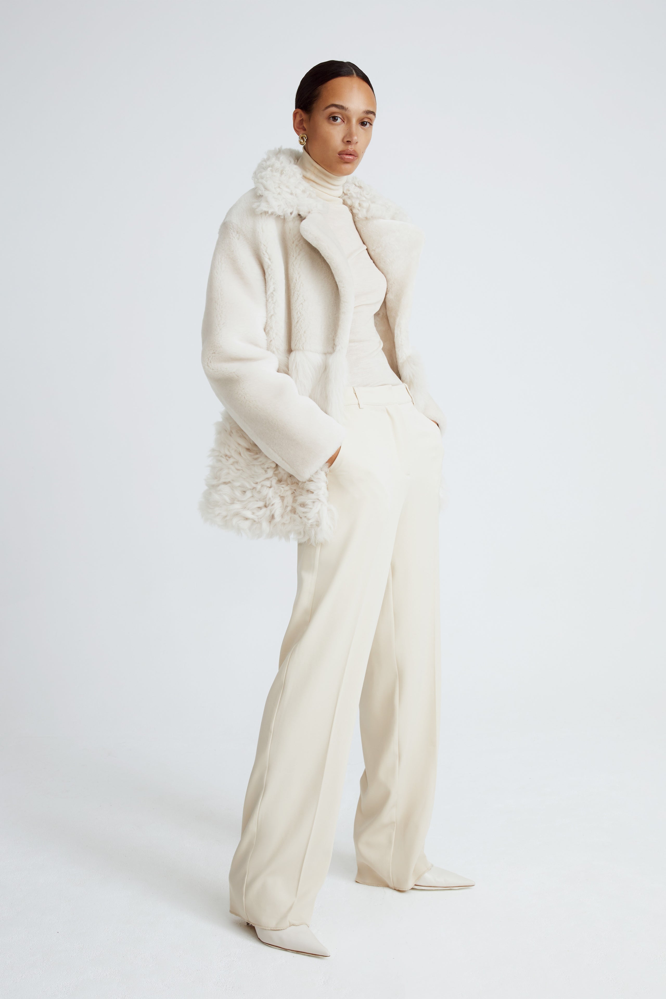 Model is wearing the Anouk Marshmallow Luxurious Shearling Coat Side