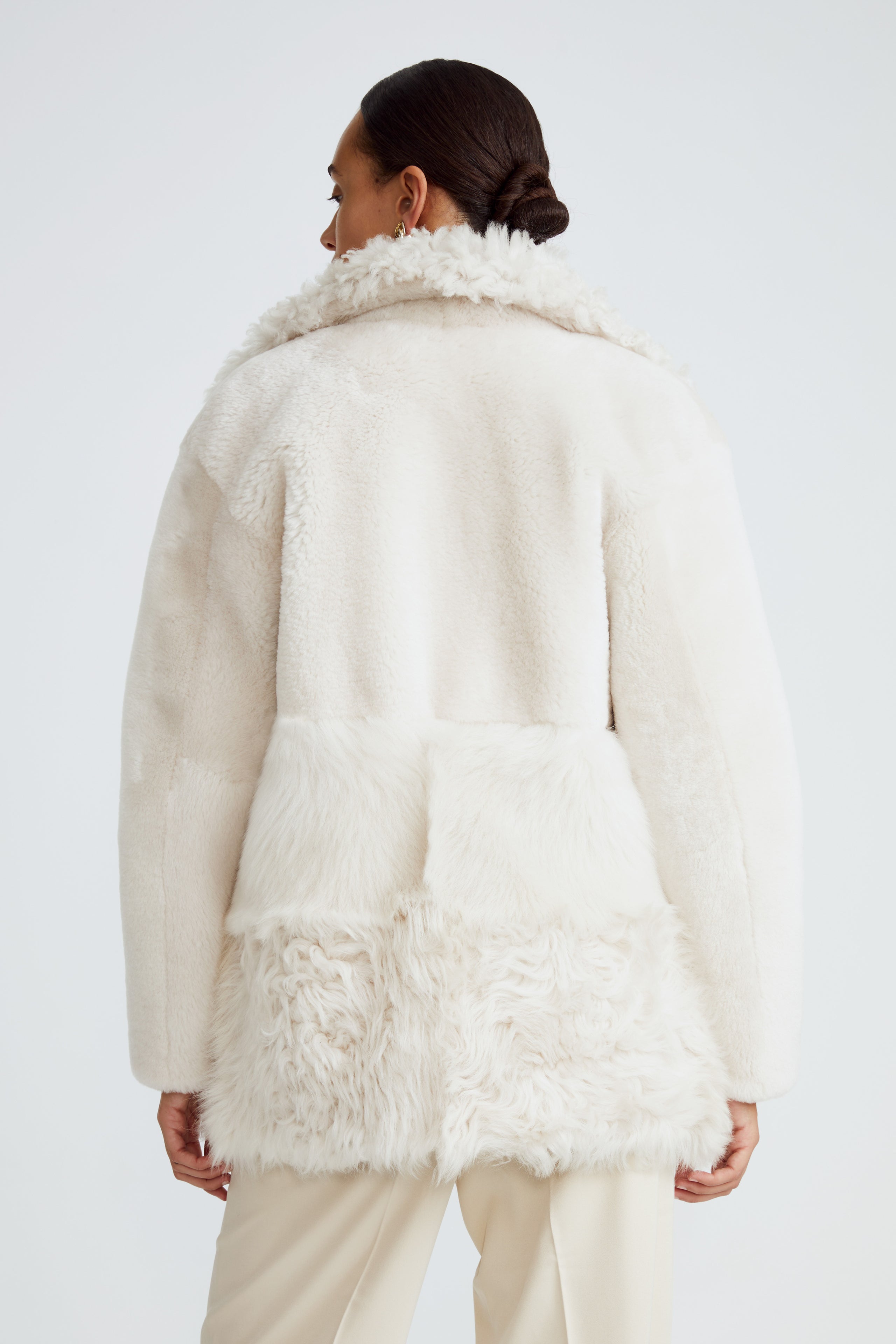 Model is wearing the Anouk Marshmallow Luxurious Shearling Coat Back