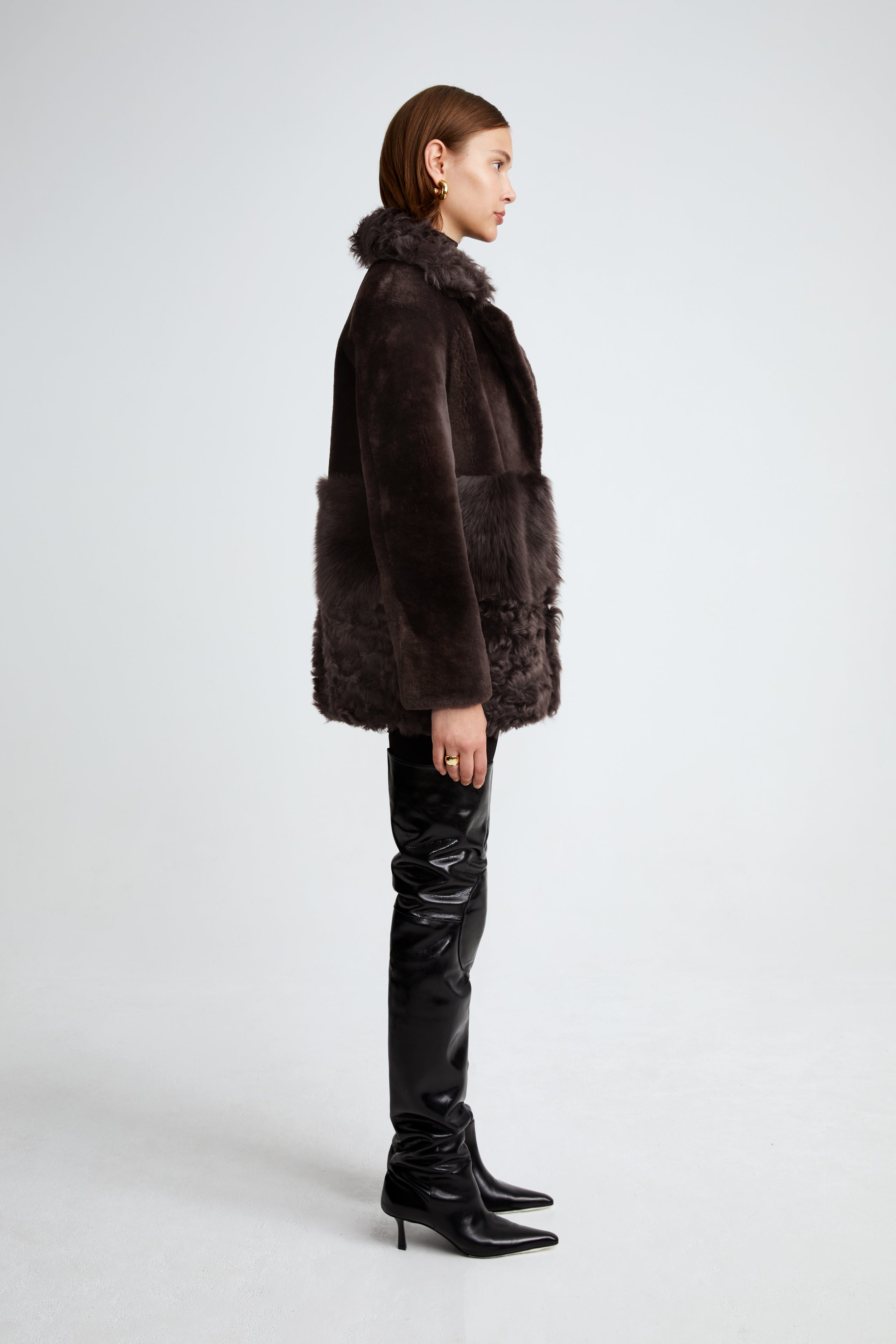 Model is wearing the Anouk Dark Chocolate Luxurious Shearling Coat Side