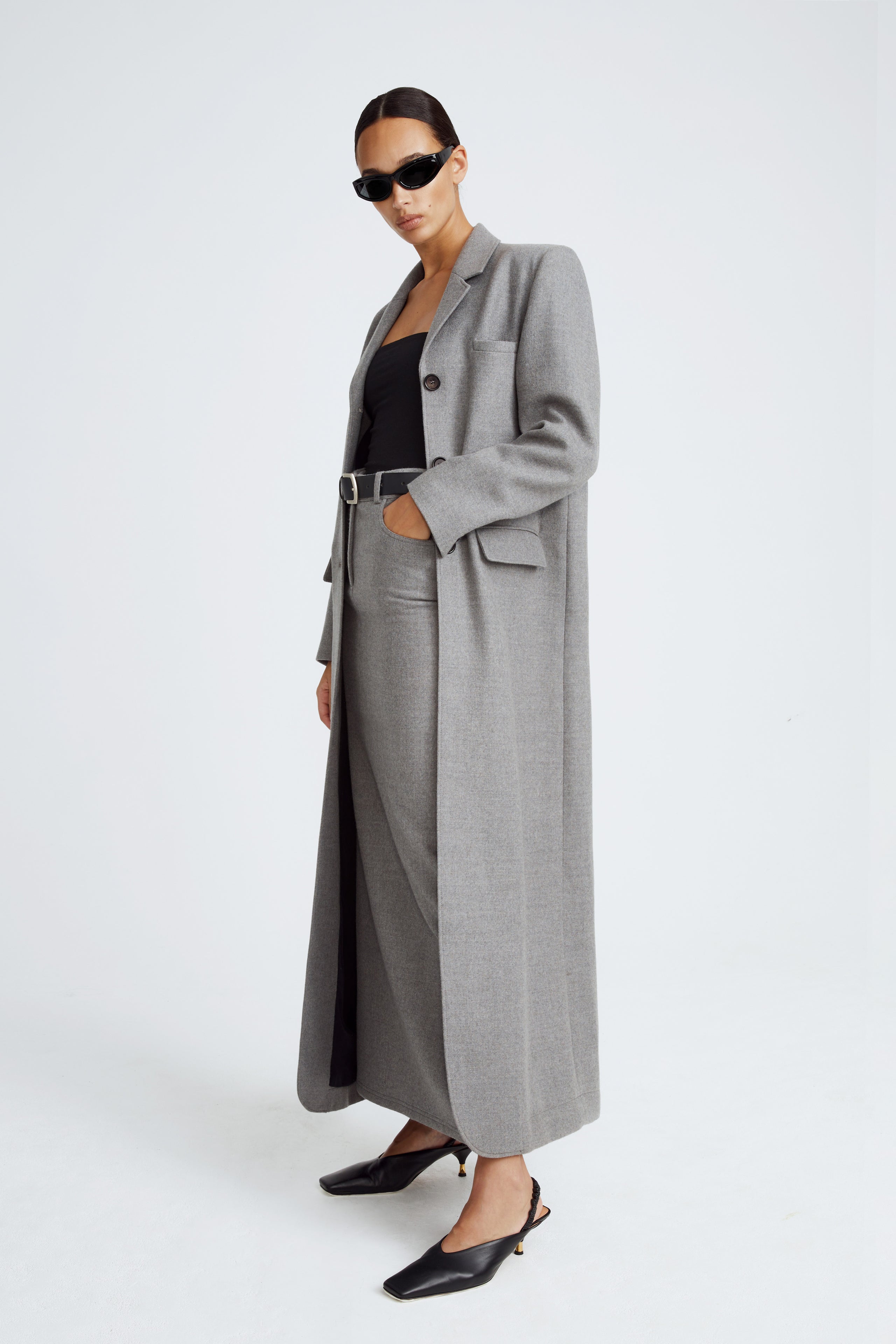 Model is wearing the Celine Light Grey Long Wool Coat Side