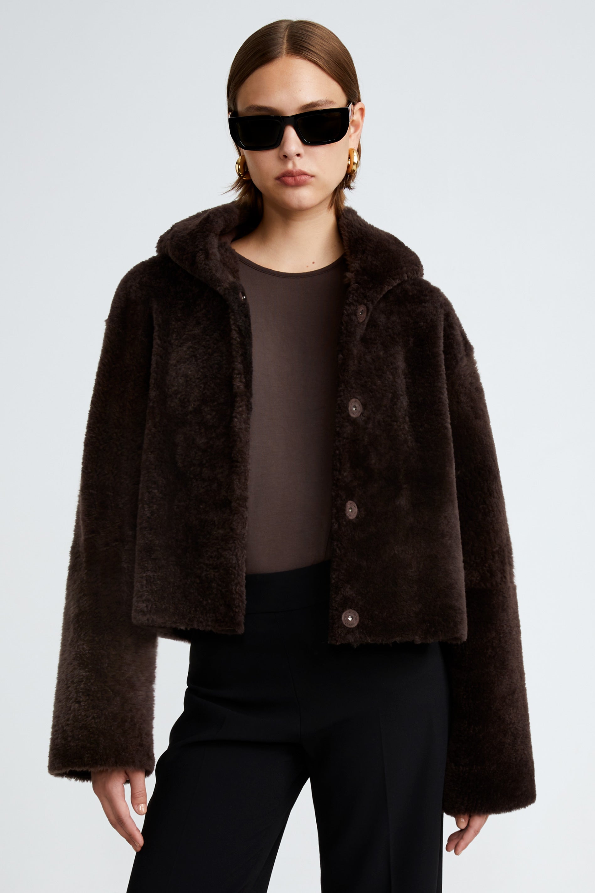 Model is wearing the Cooper Dark Chocolate Teddy Shearling Coat Close Up