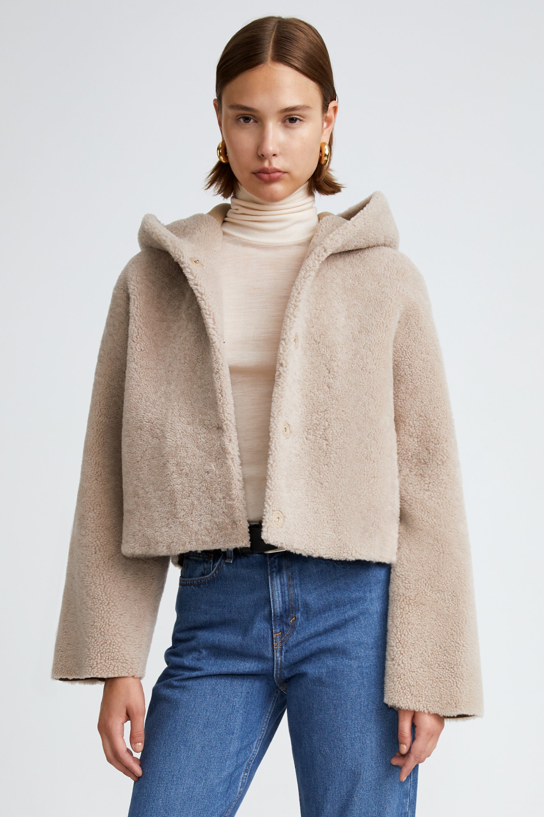 Model is wearing the Cooper Vanilla Teddy Shearling Coat Close Up