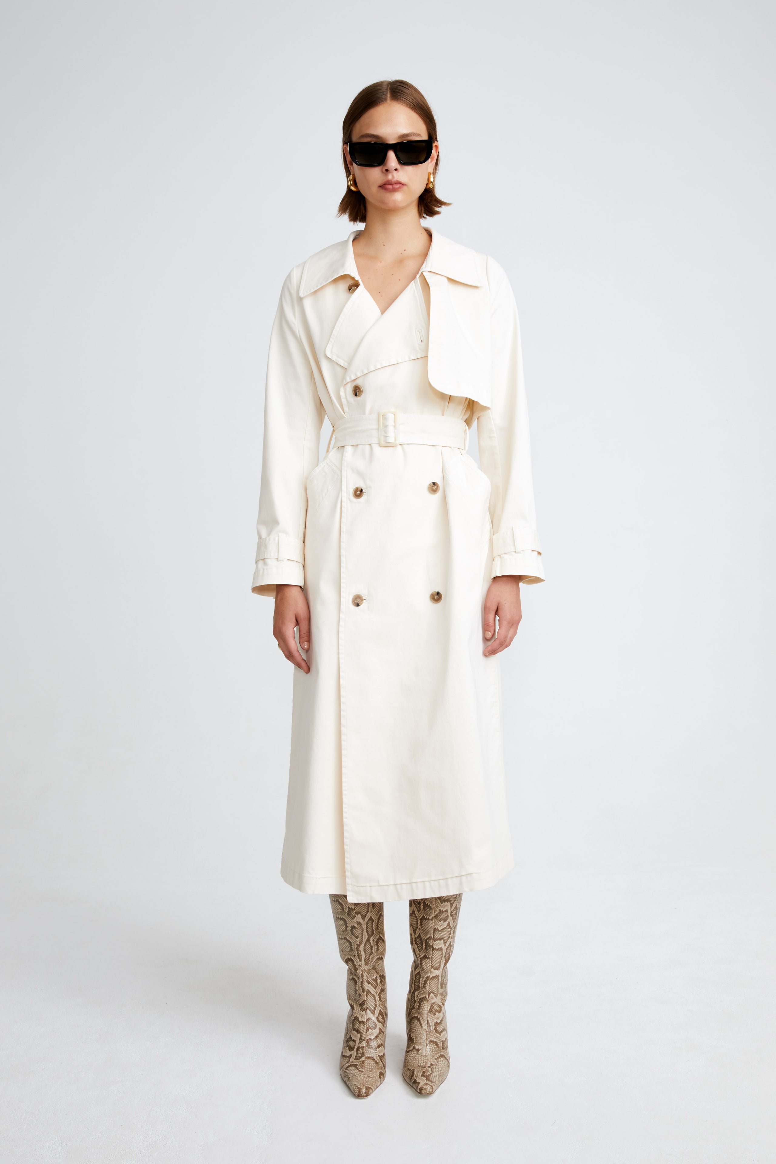 Model is wearing the Harriet Canvas Cream Long Fabric Trench Front