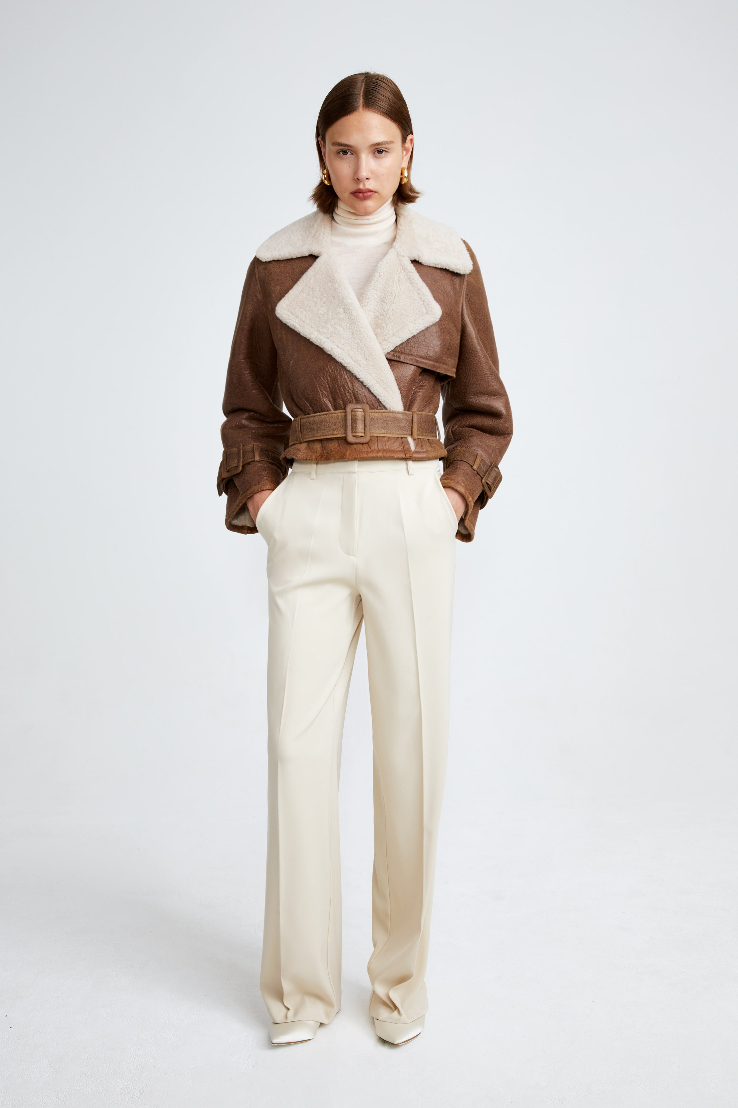 Model is wearing the Hatti Shearling Camel Ivory Cropped Shearling Jacket Front
