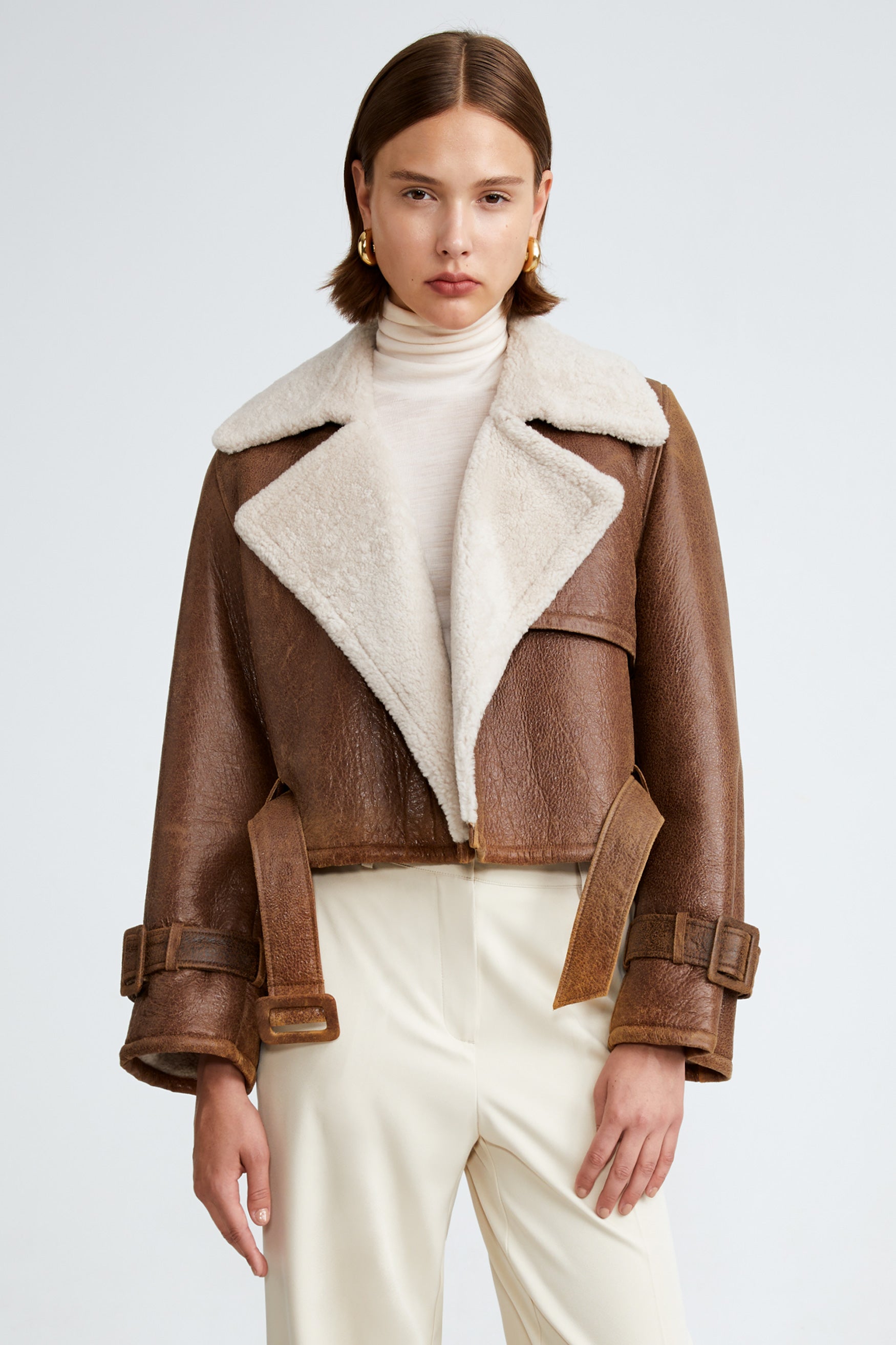 Model is wearing the Hatti Shearling Camel Ivory Cropped Shearling Jacket Close Up