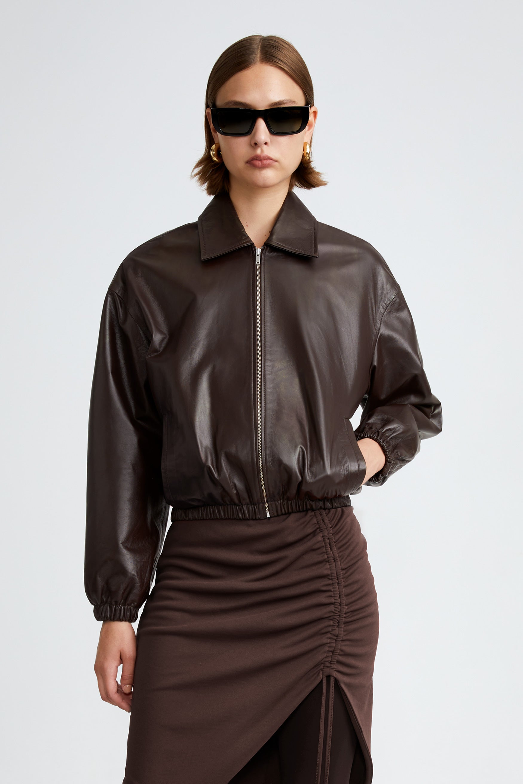 Model is wearing the Luna Dark Chocolate Leather Bomber Jacket Close Up