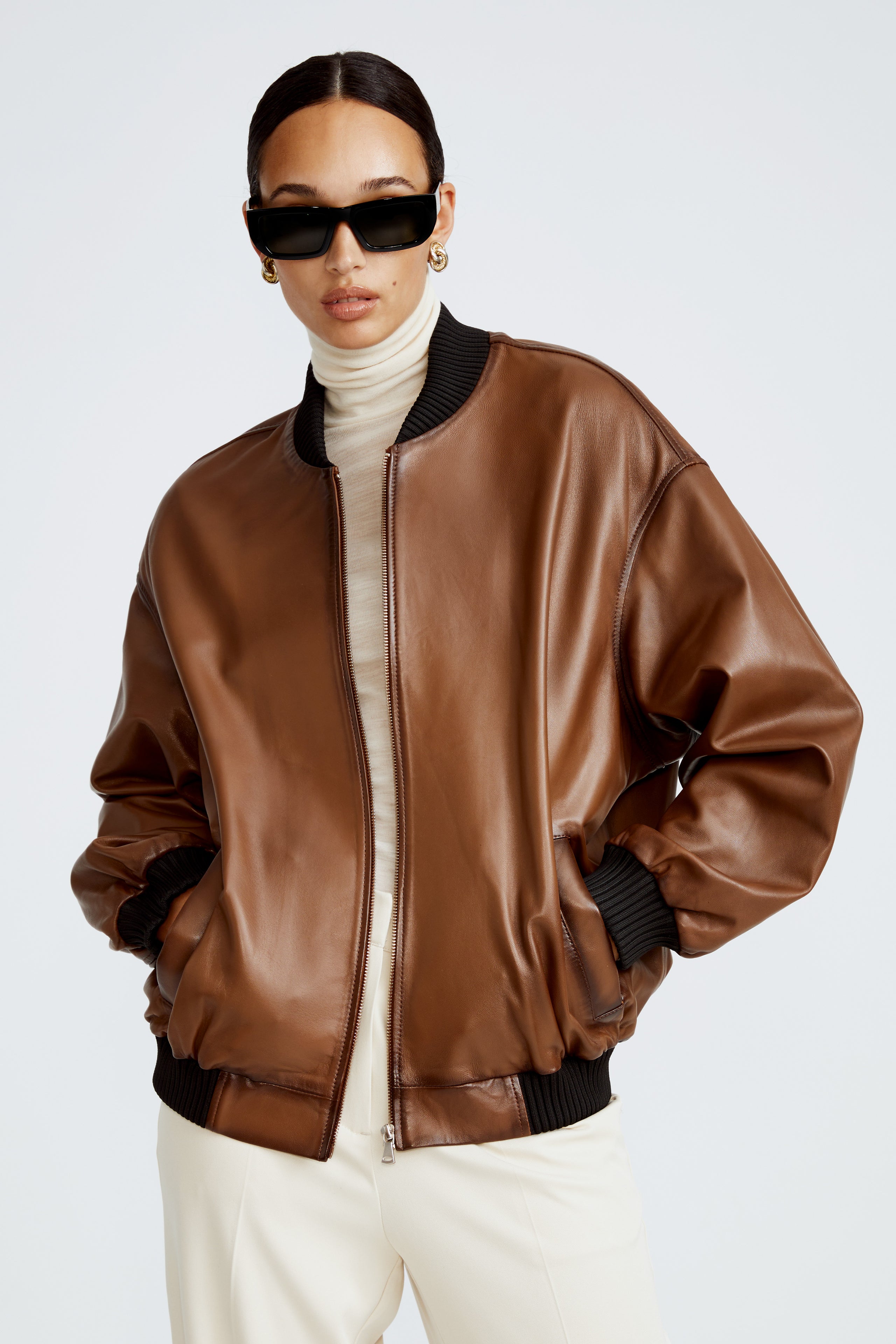 Model is wearing the Marly Brown Leather Bomber Jacket Close Up