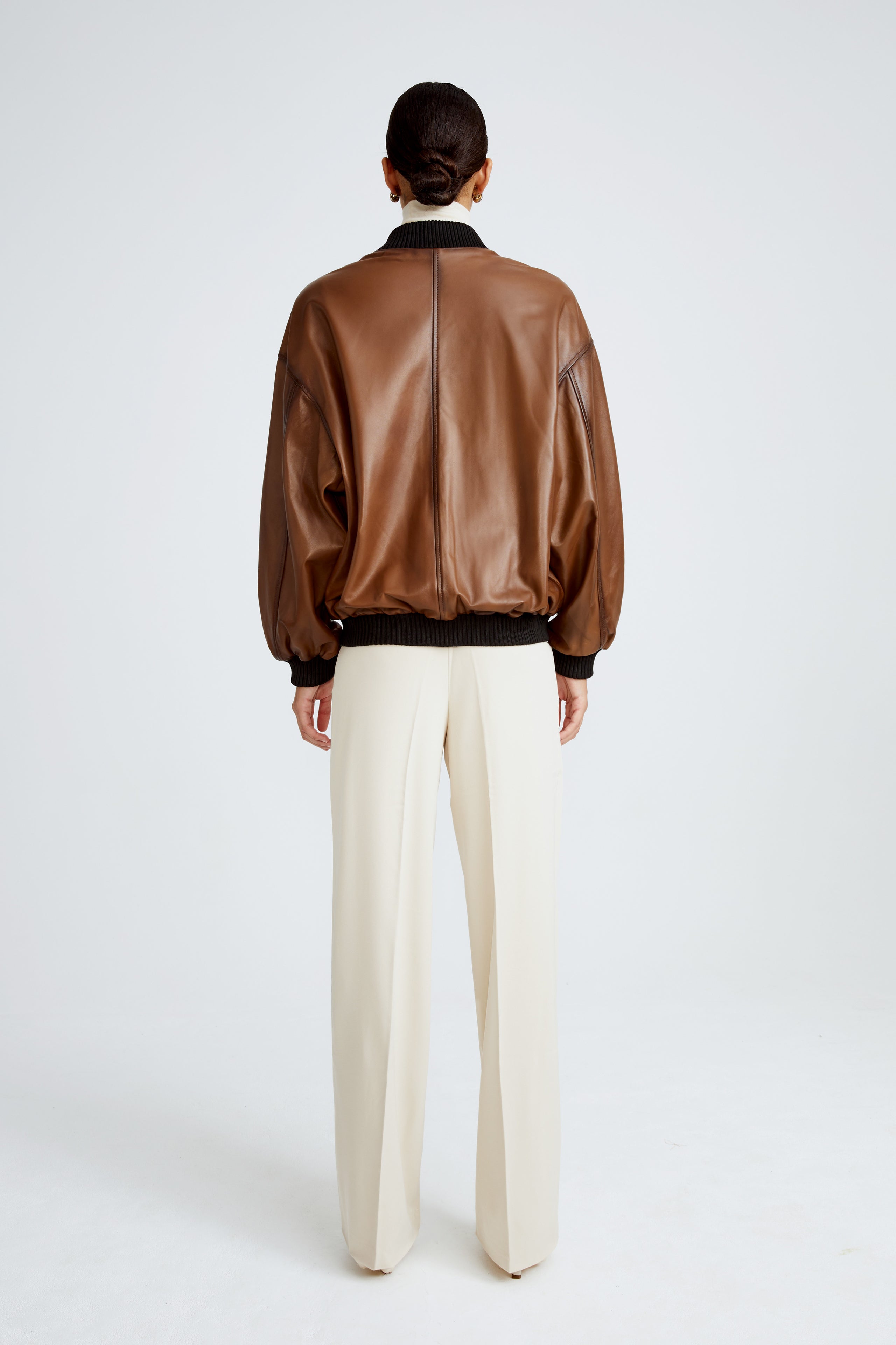 Model is wearing the Marly Brown Leather Bomber Jacket Back