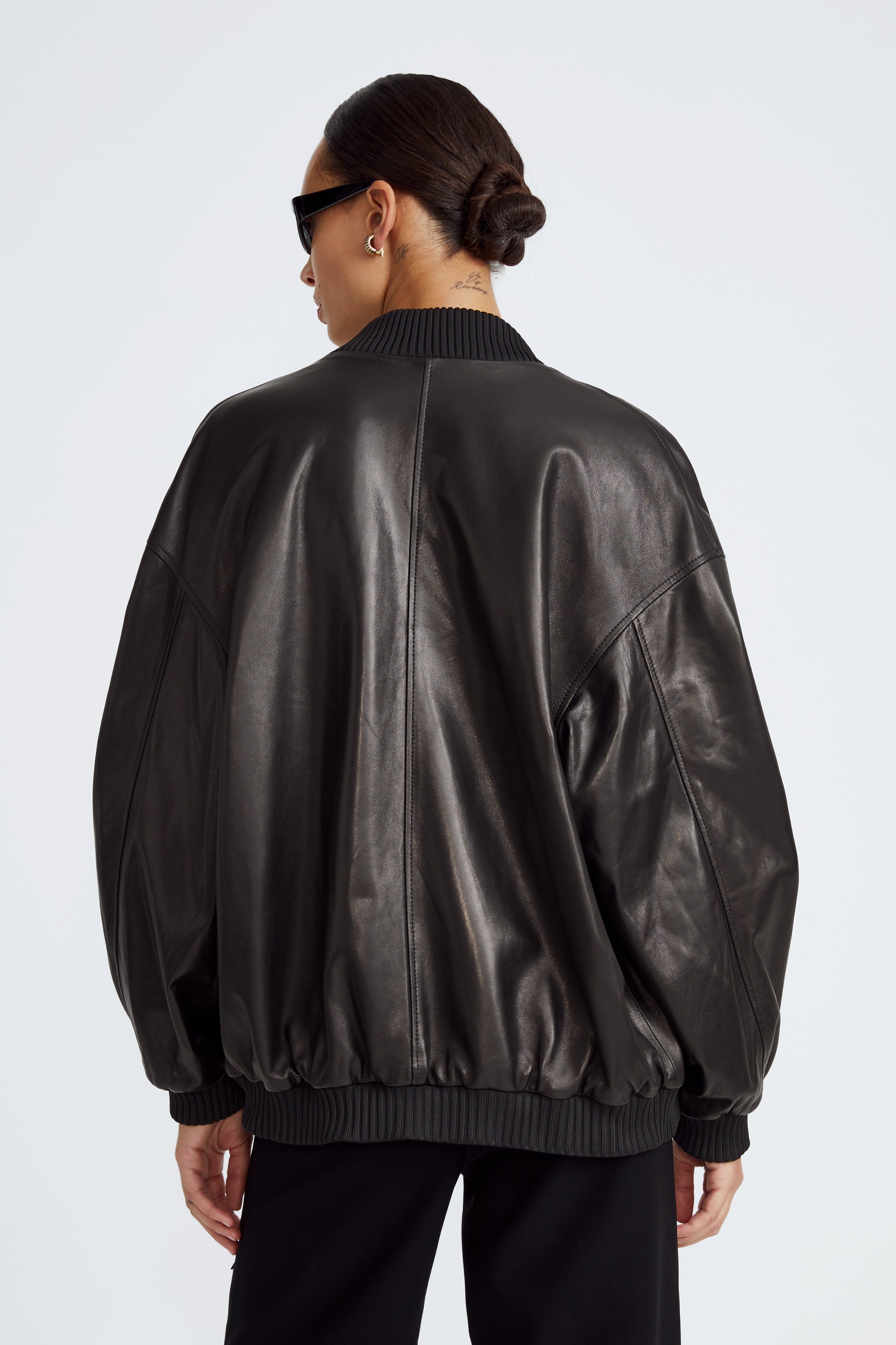 Model is wearing the Marly Black Leather Bomber Jacket Back