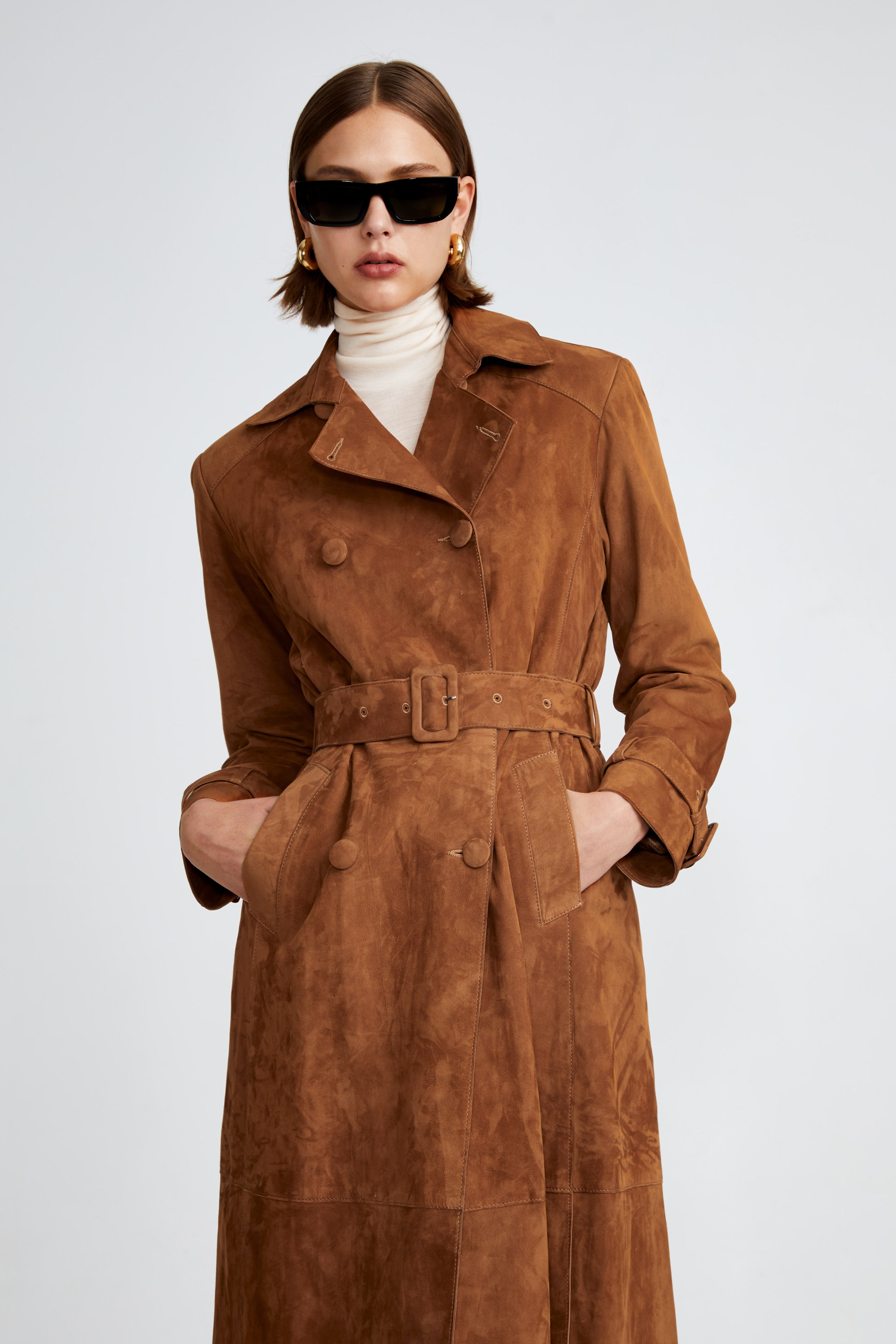 Model is wearing the Tate Caramel Everyday Suede Trench Coat Close Up