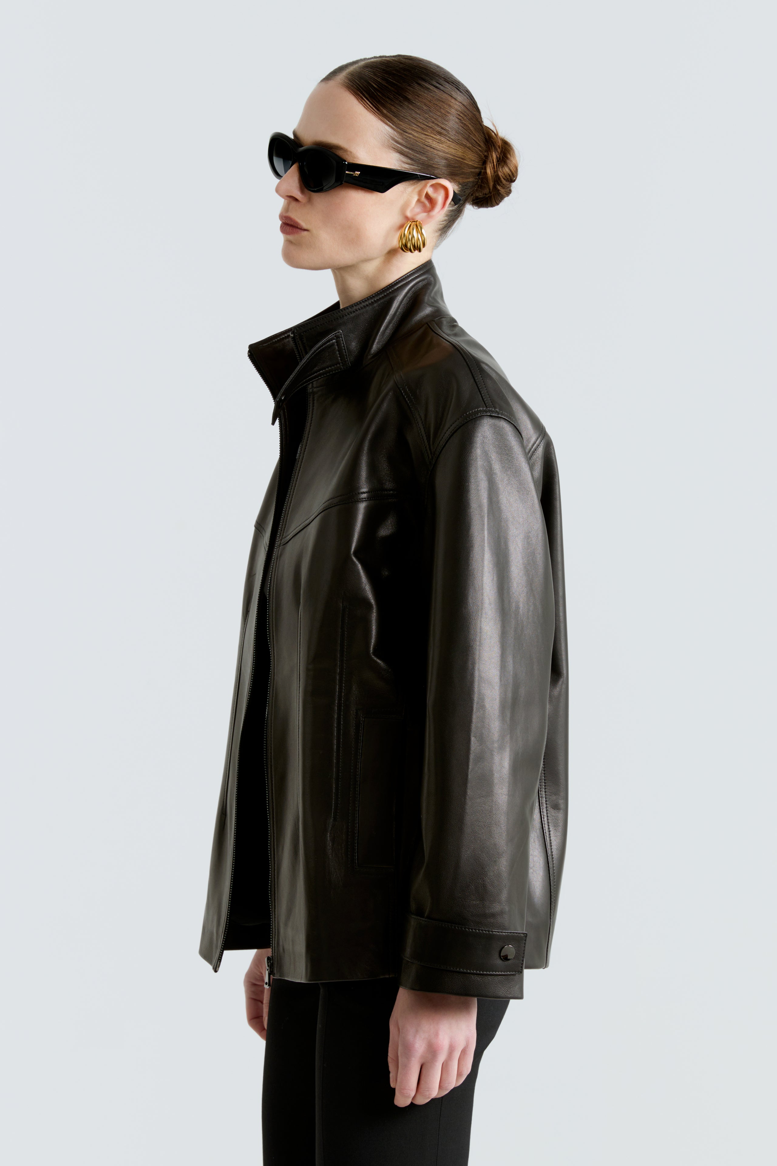 Model is wearing the Rue Black Leather Bomber Jacket Side