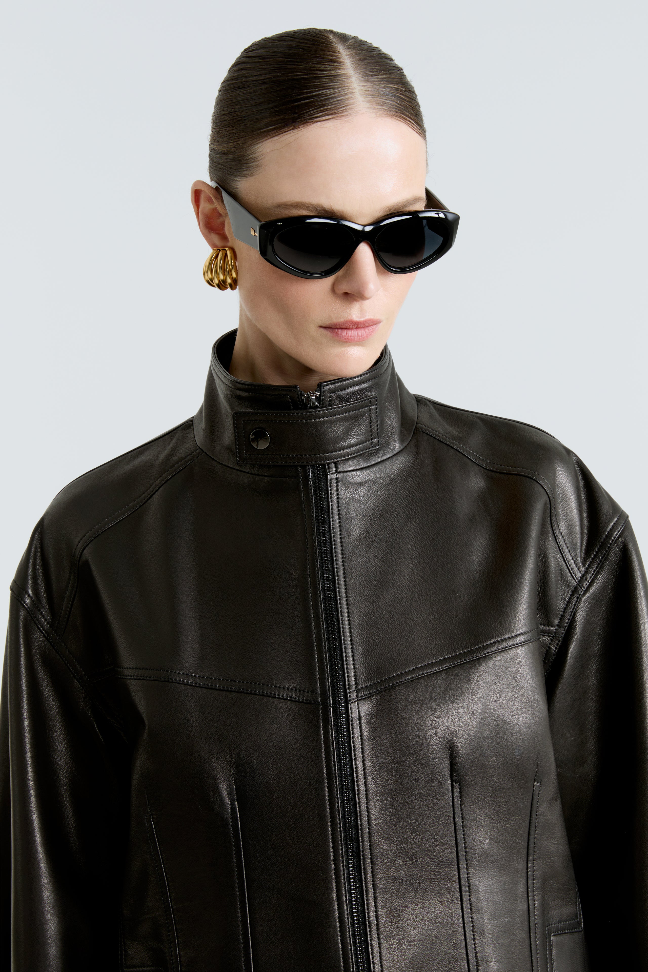 Model is wearing the Rue Black Leather Bomber Jacket Close Up