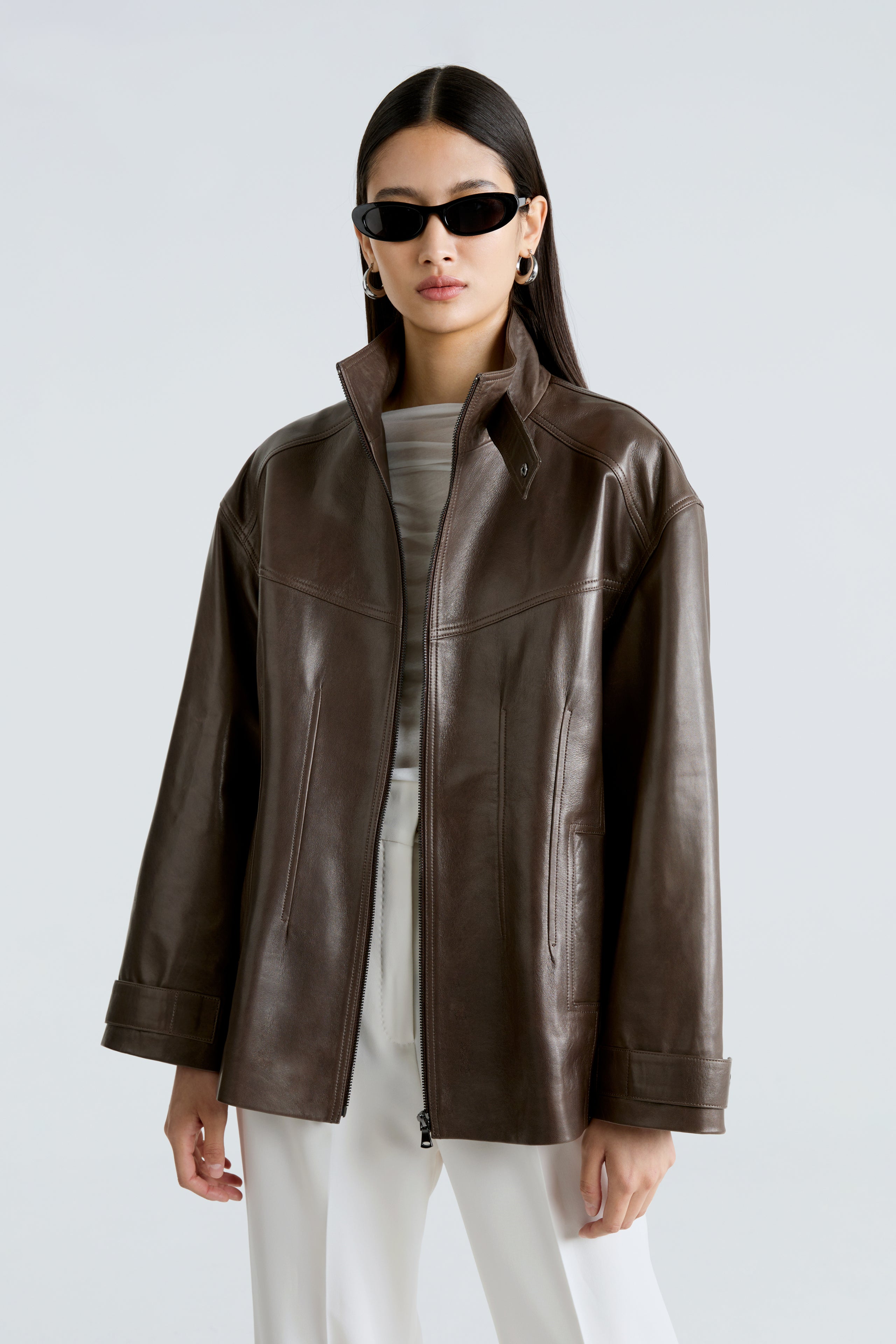 Model is wearing the Rue Truffle Leather Bomber Jacket Close Up