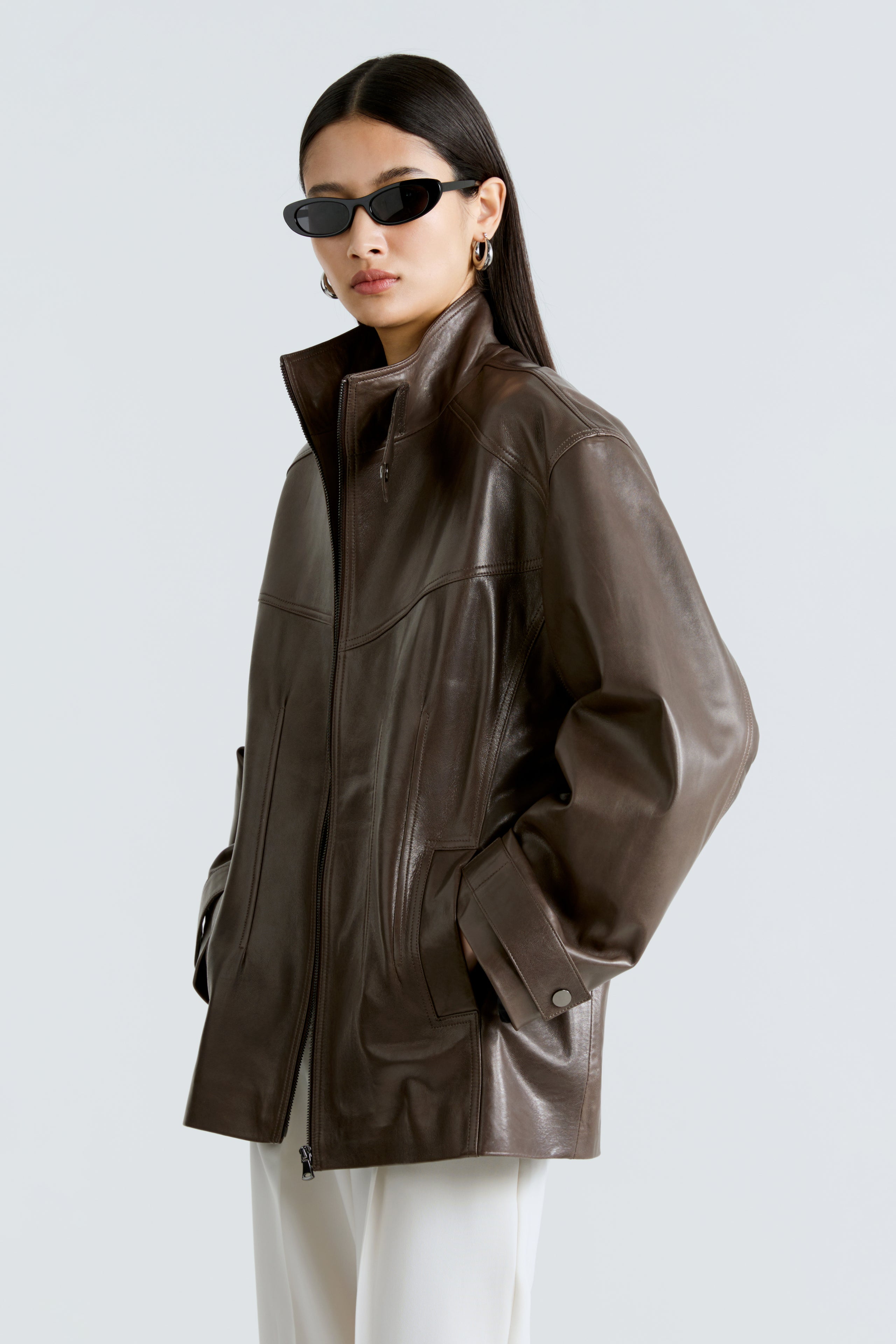 Model is wearing the Rue Truffle Leather Bomber Jacket Side