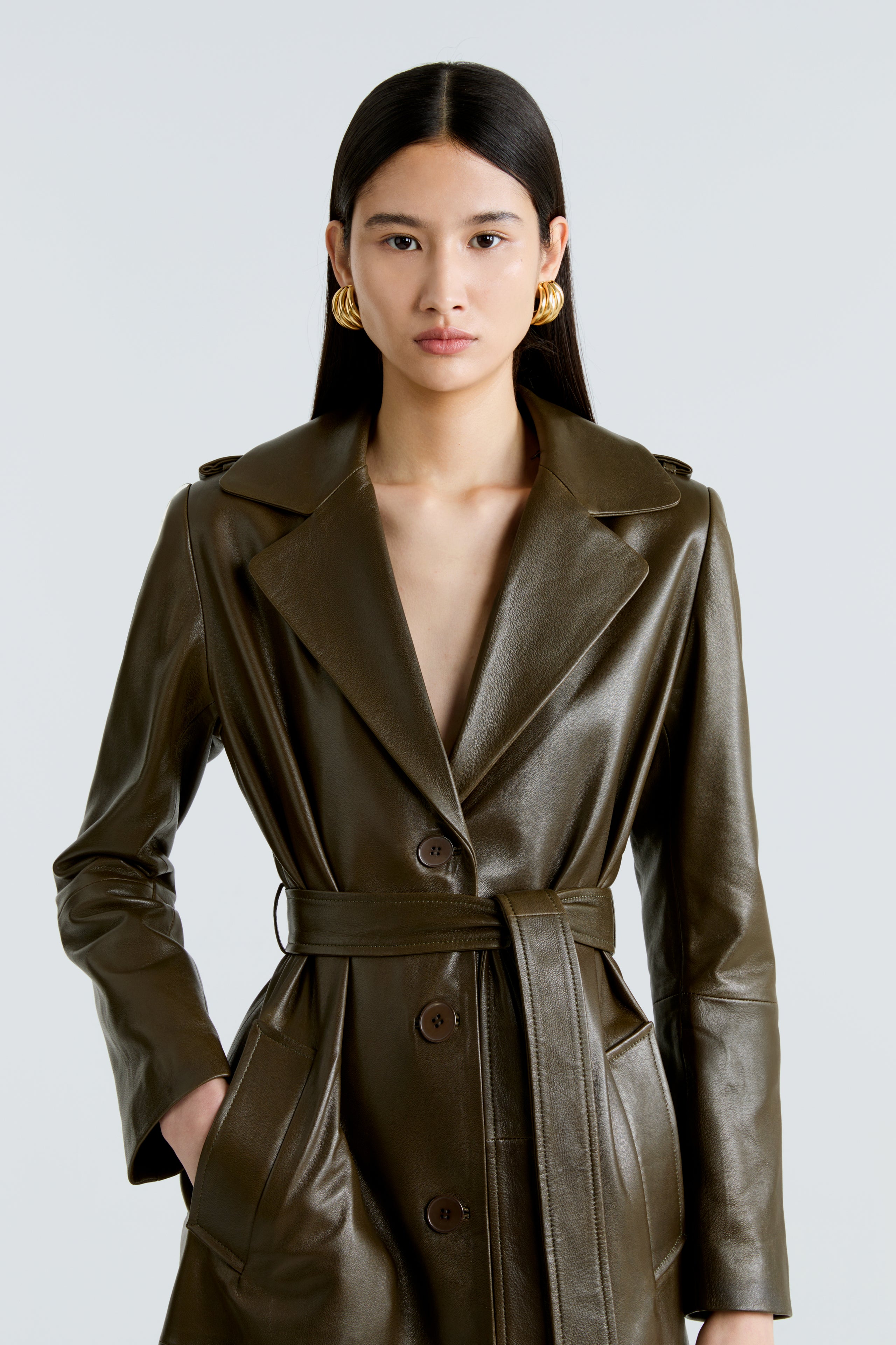 Model is wearing the Scarlett Zeytoun Belted Leather Coat Close Up