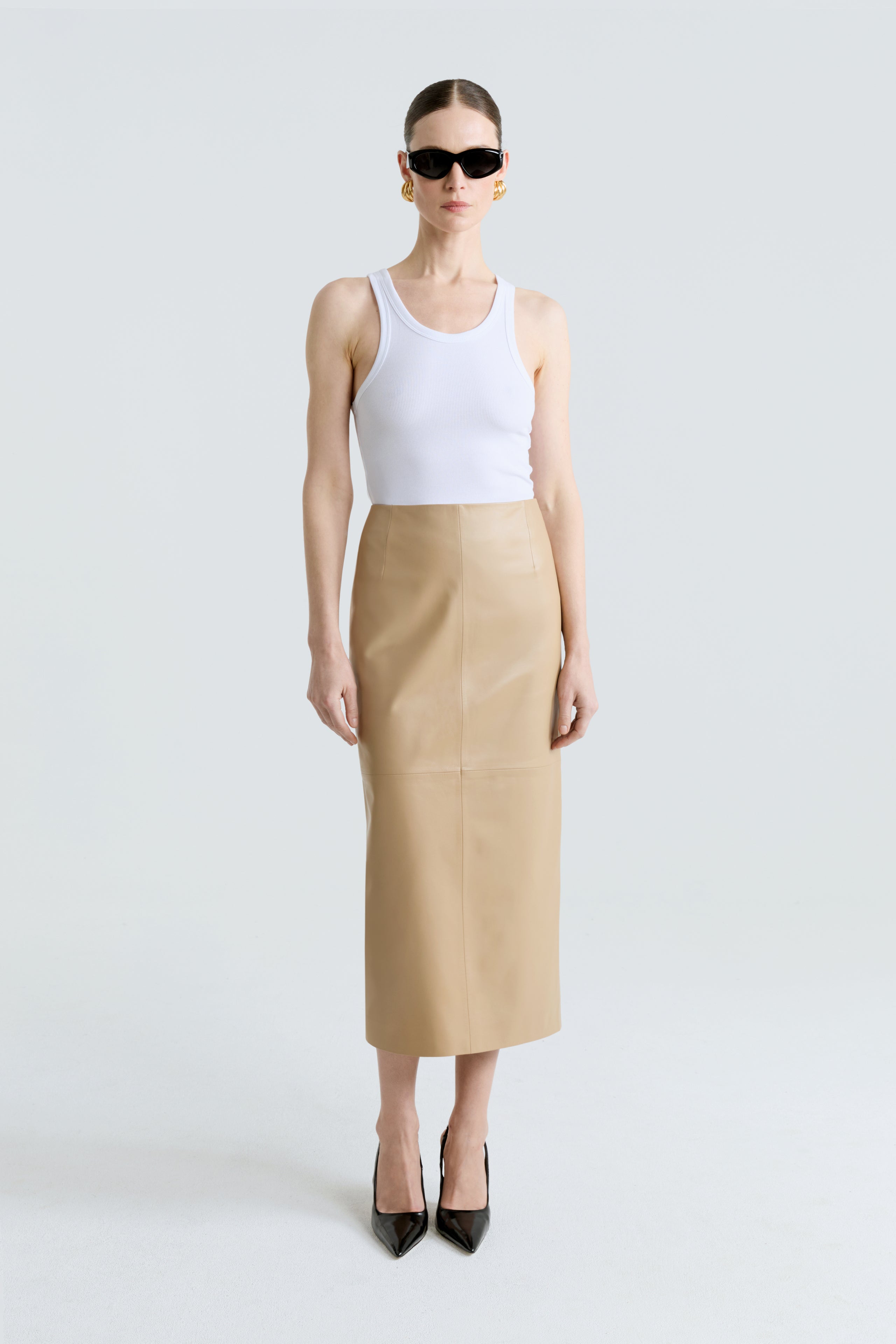 Model is wearing the Selly Skirt Beige Pencil Leather Skirt Front
