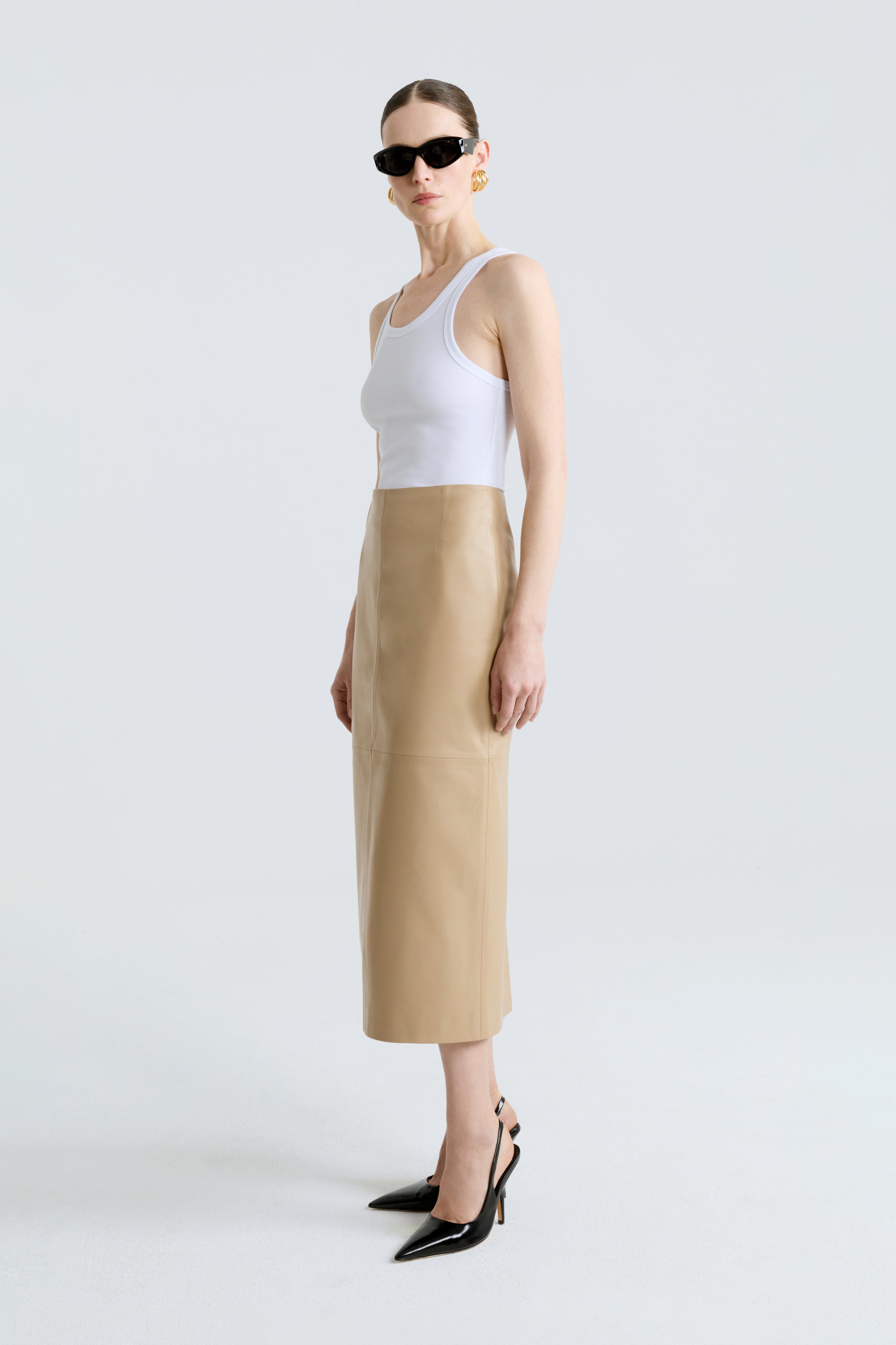 Model is wearing the Selly Skirt Beige Pencil Leather Skirt Side