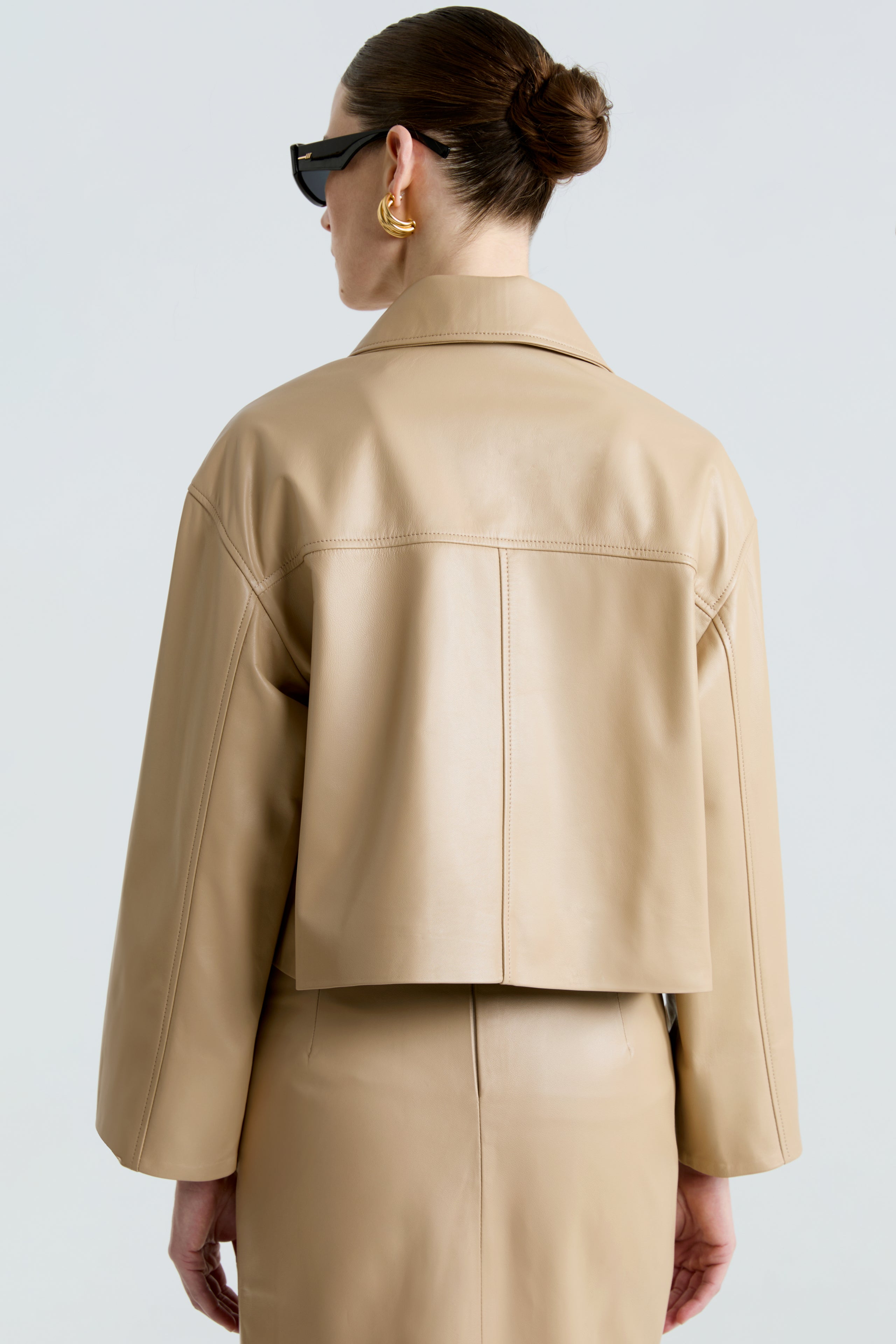 Model is wearing the Sloan Beige Minimalist Leather Jacket Close Up