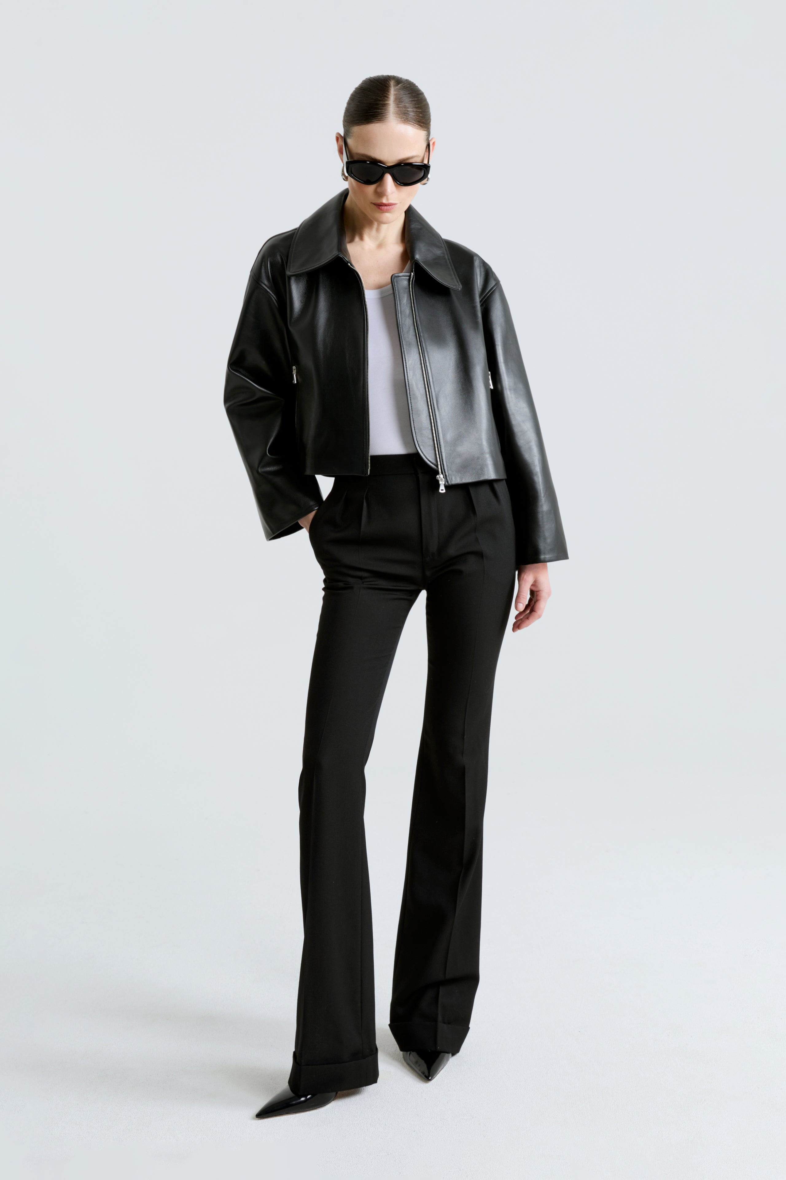 Model is wearing the Sloan Black Minimalist Leather Jacket Front