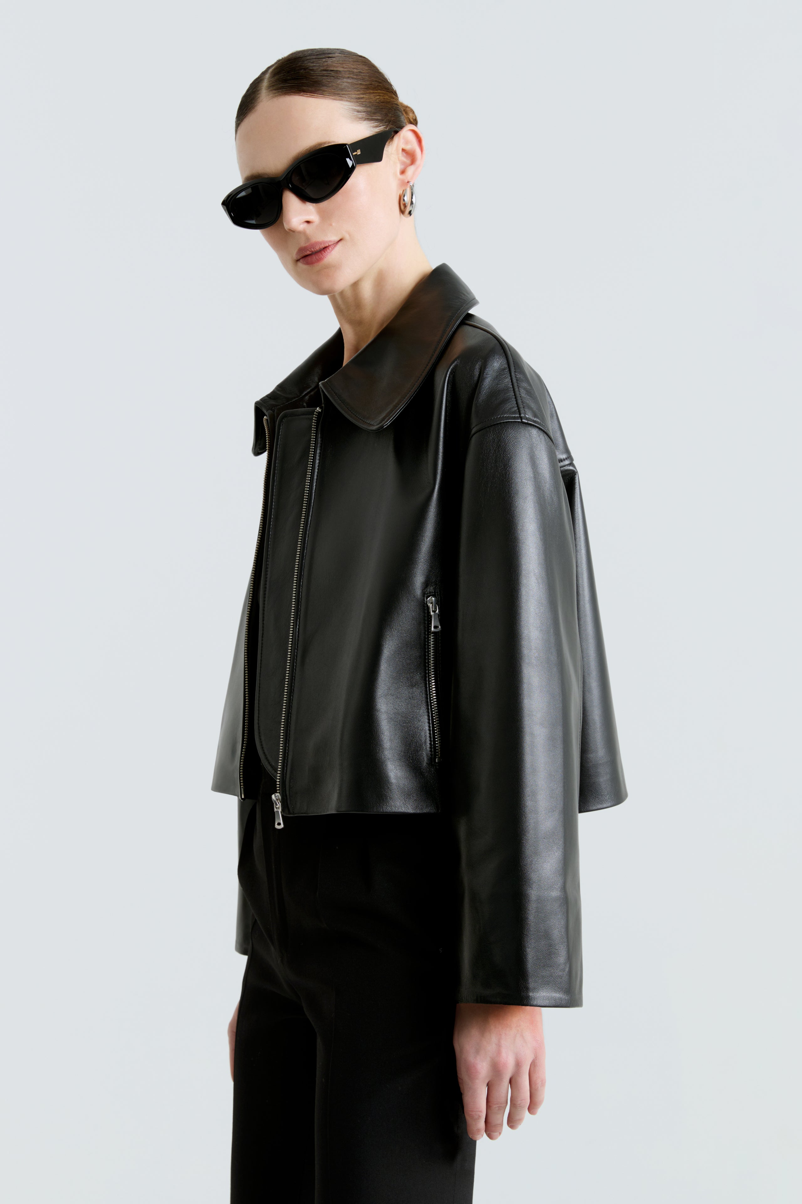 Model is wearing the Sloan Black Minimalist Leather Jacket Close Up