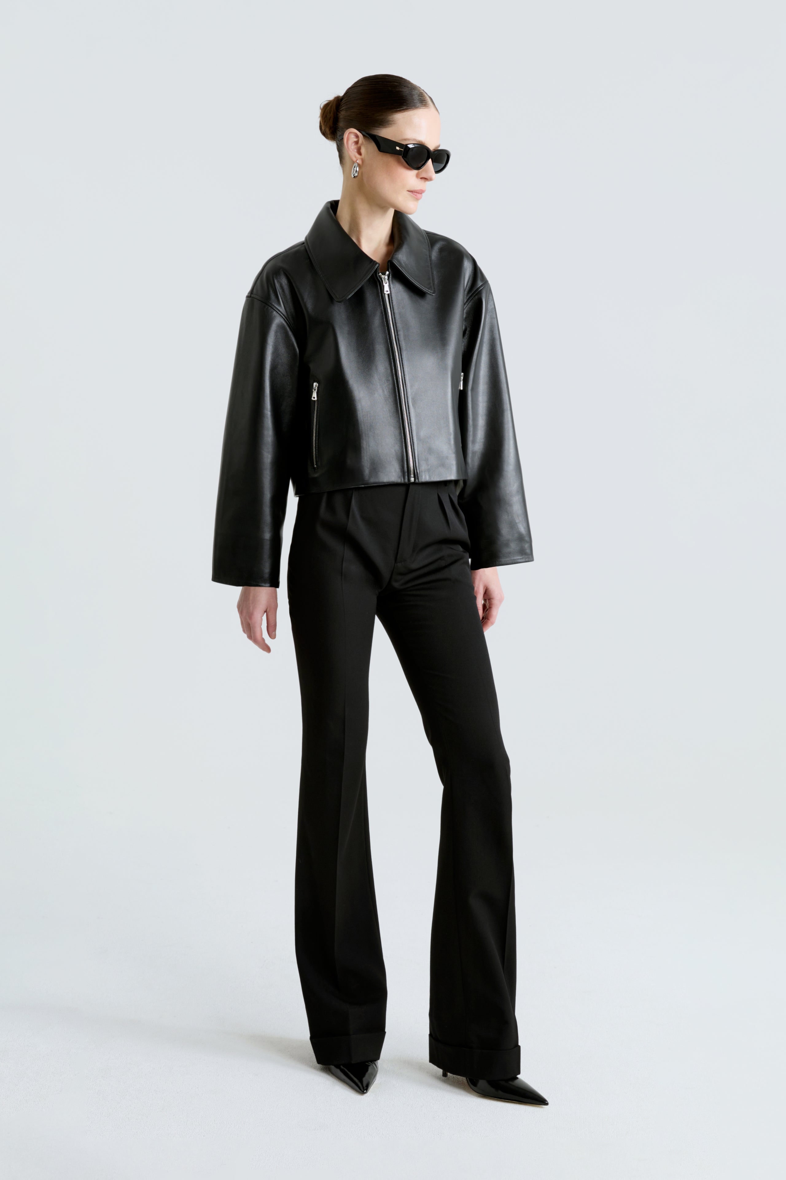 Model is wearing the Sloan Black Minimalist Leather Jacket Front